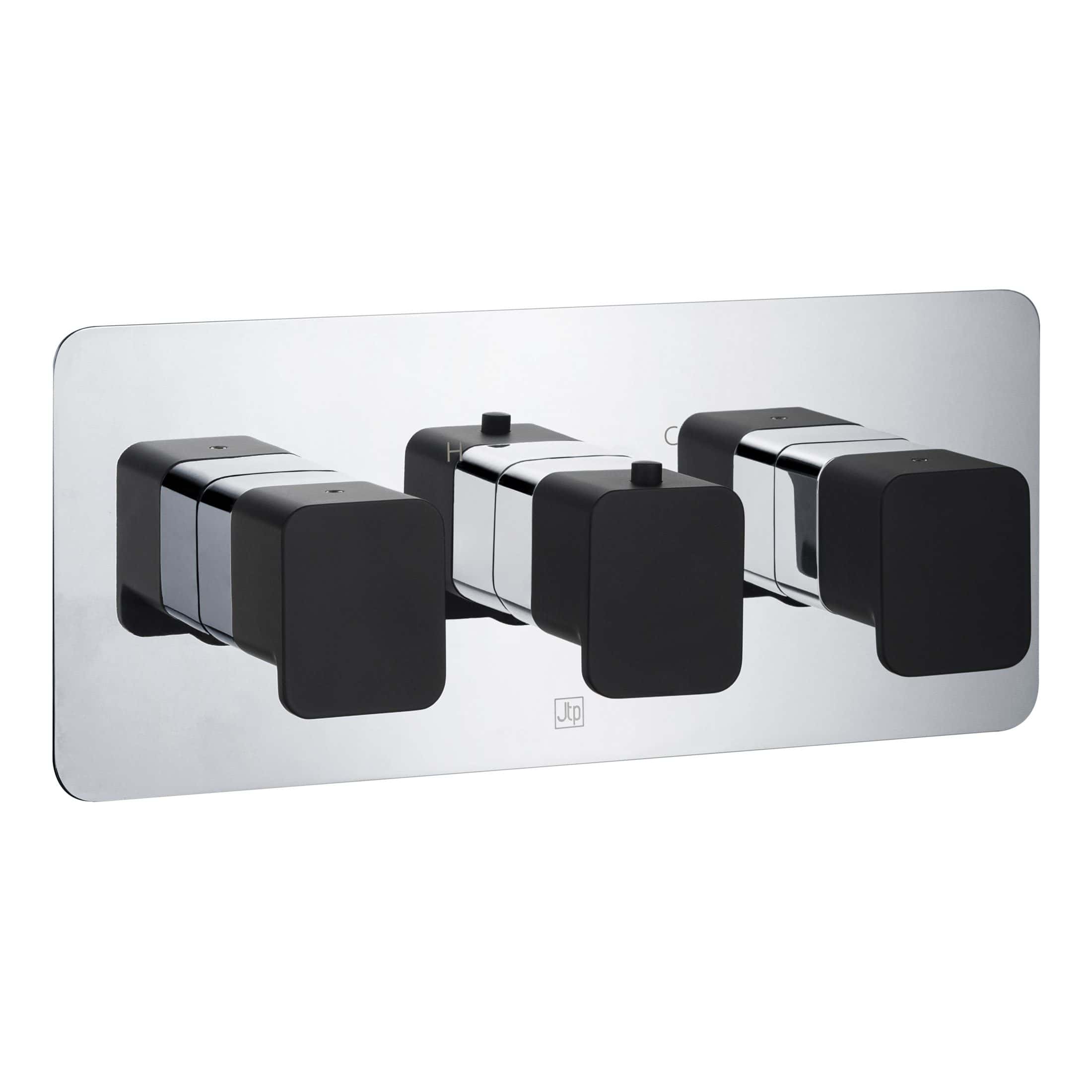 Sleek modern radiator control panel with three black and chrome thermostatic valves, designed for efficient bathroom heating systems.