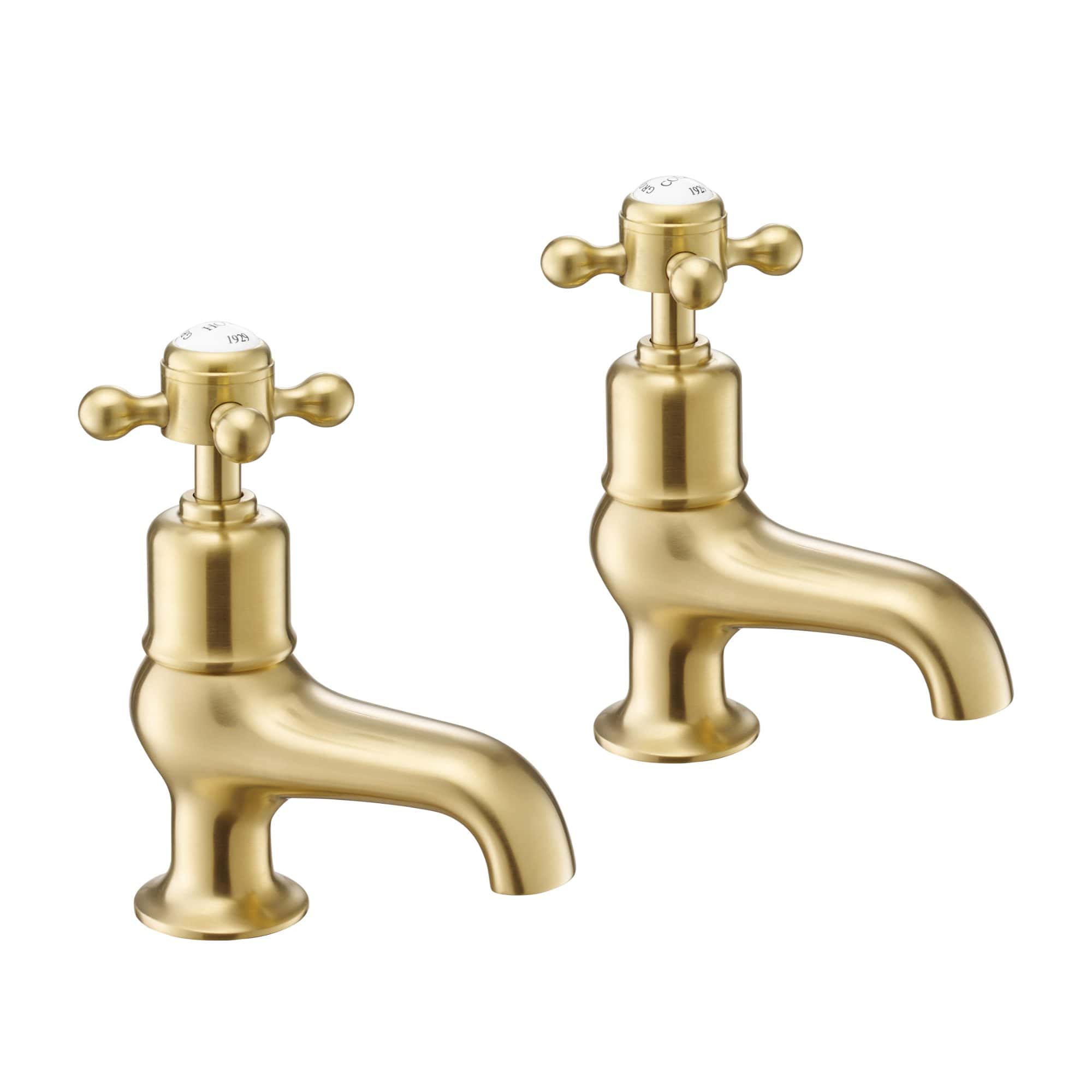 Brass bathroom taps with traditional cross handles, ideal for vintage or classic bathroom designs, offering durability and a timeless aesthetic.