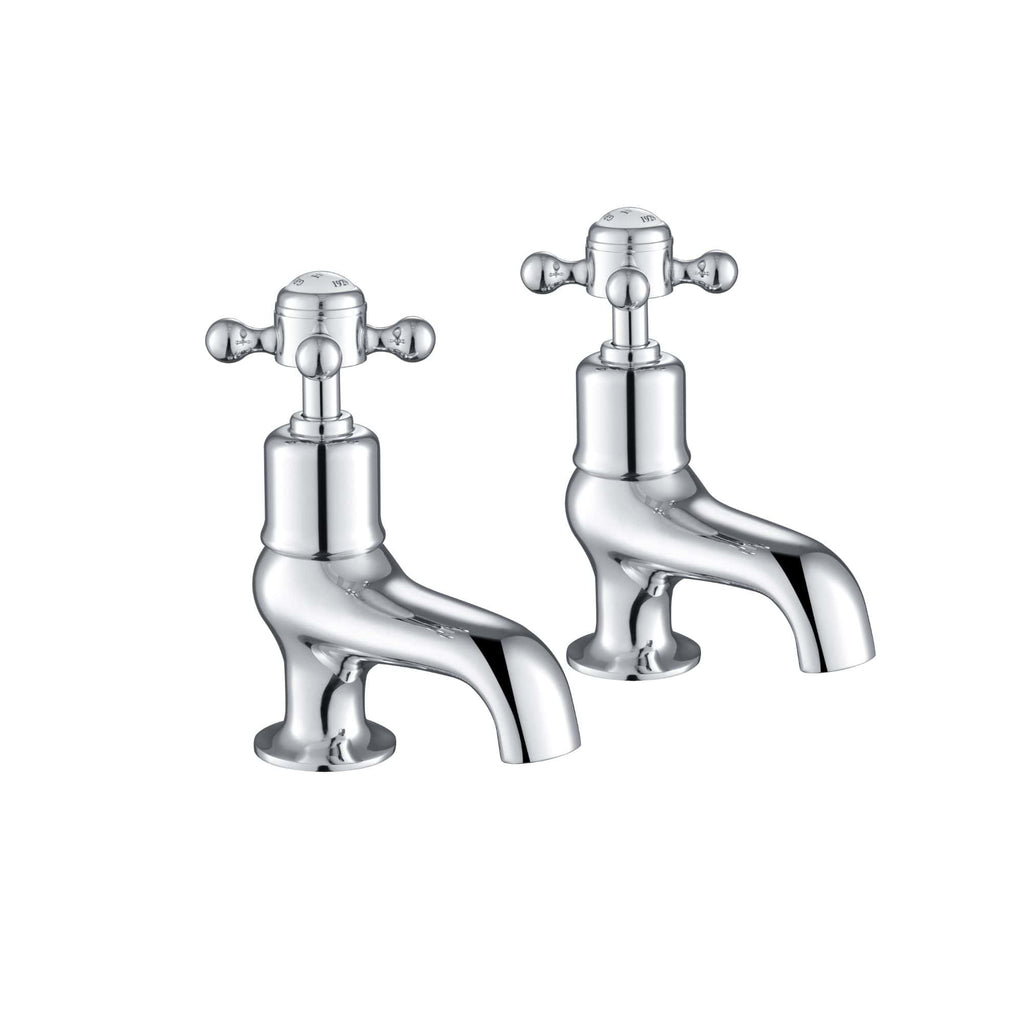 Shiny chrome traditional bathroom taps with cross handles, ideal for classic bathroom sink decor. Perfect for installing or replacing vintage-style tapware.