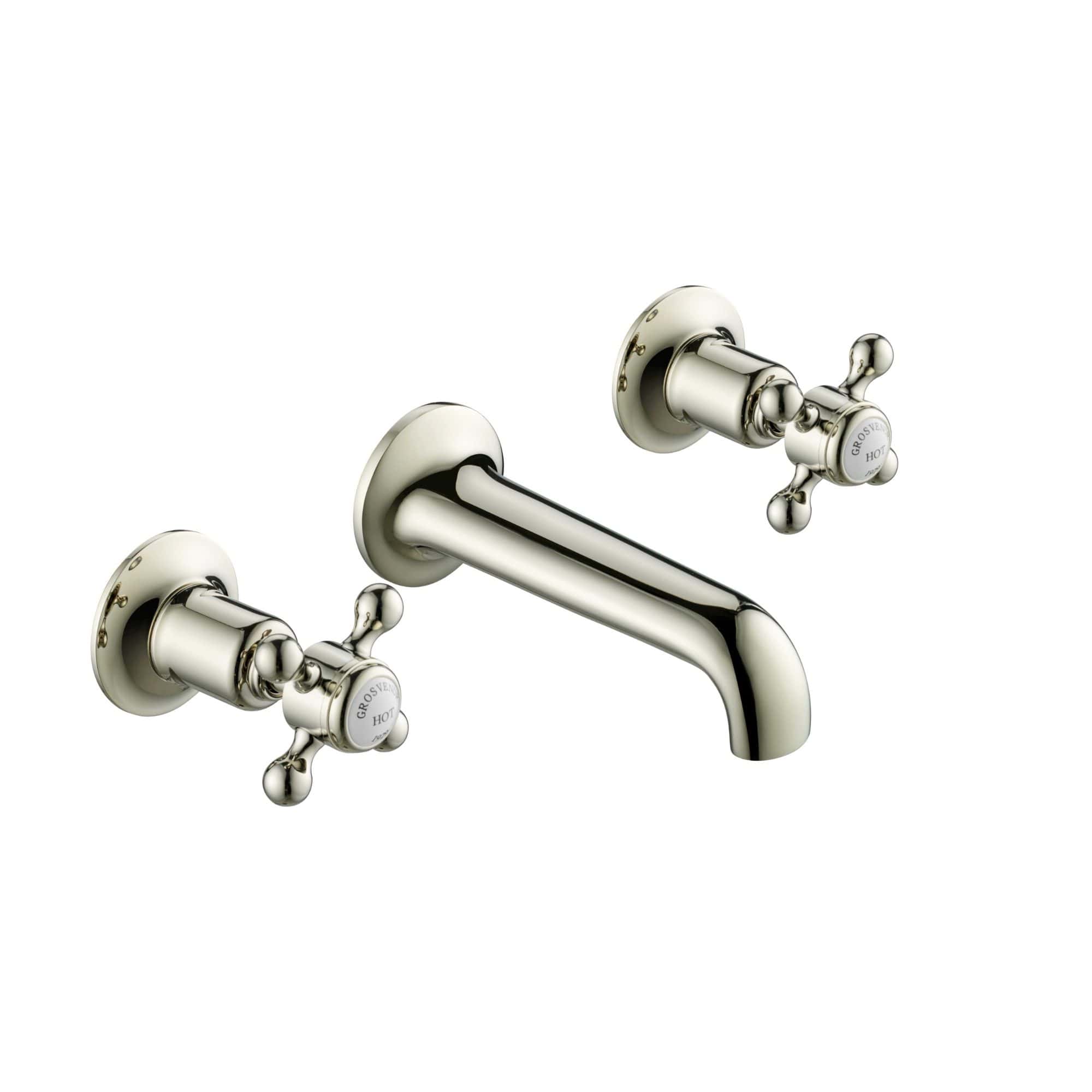Elegant chrome bathroom sink tap with dual cross-handle controls for hot and cold water, designed for classic and vintage bathroom decor.