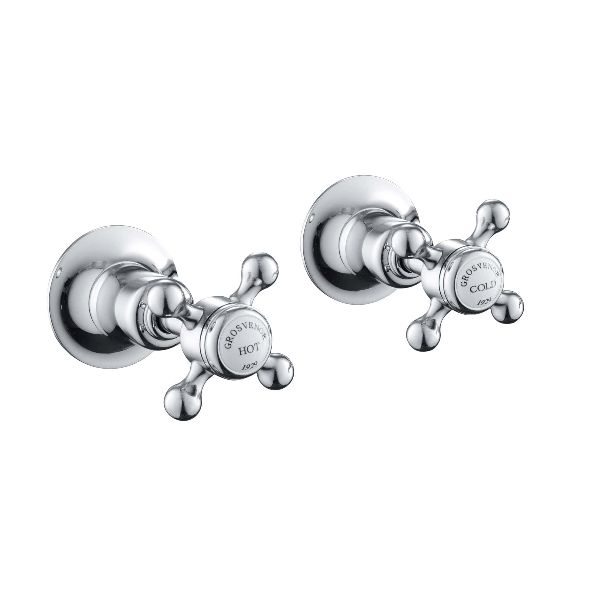 Shiny chrome bathroom hot and cold tap handles with vintage style, perfect for classic bathroom fittings and plumbing fixtures.
