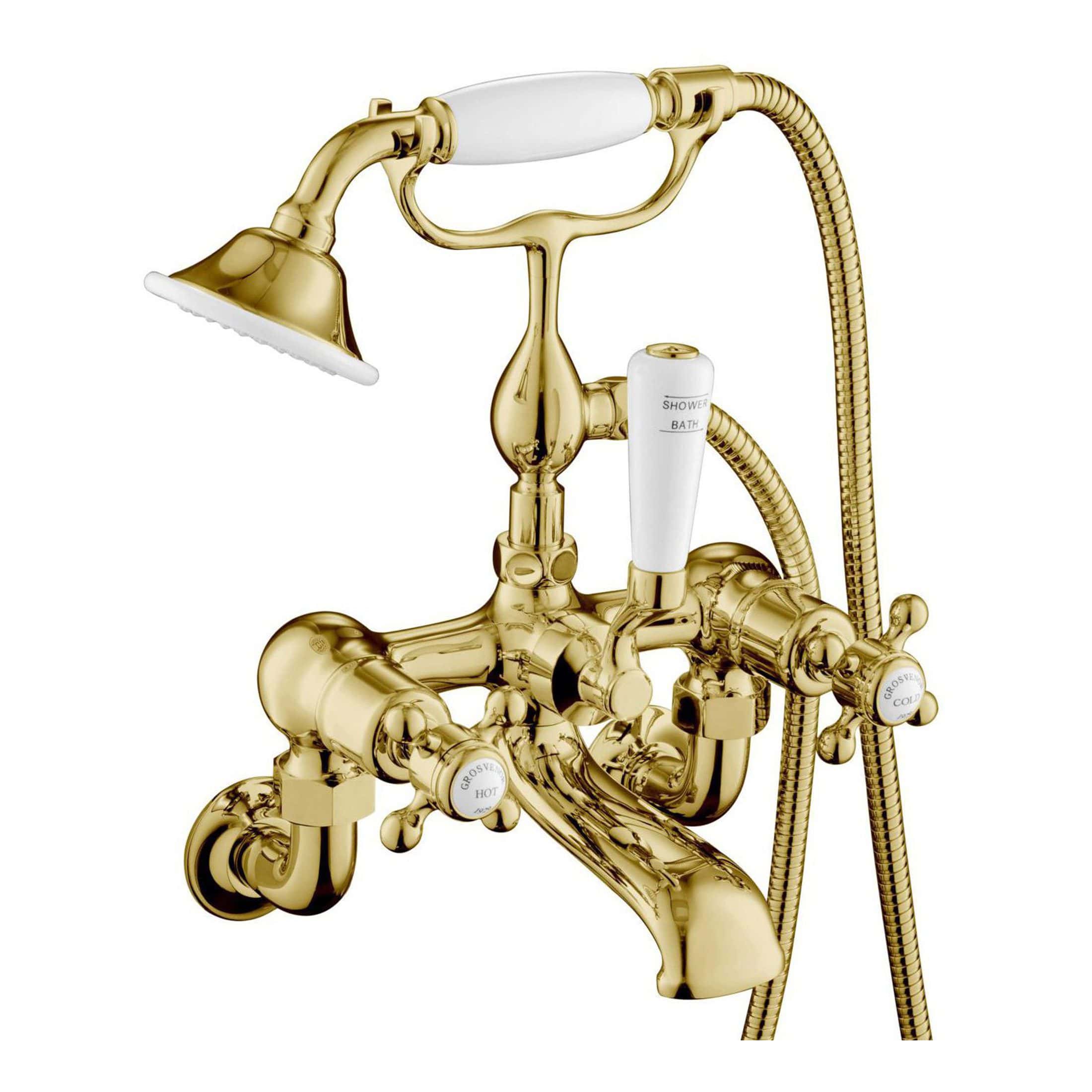 Elegant gold bathroom mixer tap with handheld shower and vintage style handles, perfect for luxury bathroom decor.