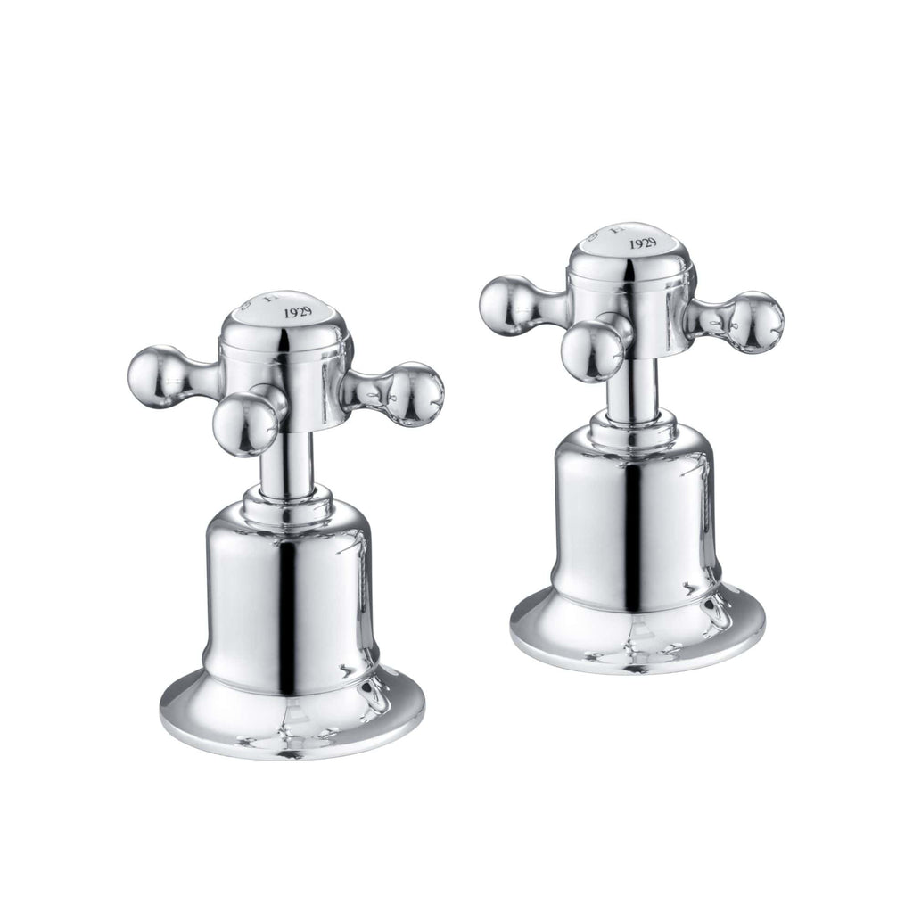 Shiny chrome bathroom tap handles with cross-shaped levers, vintage design, ideal for classic bathroom fixtures, demonstrating high-quality craftsmanship, model year engraved on top.