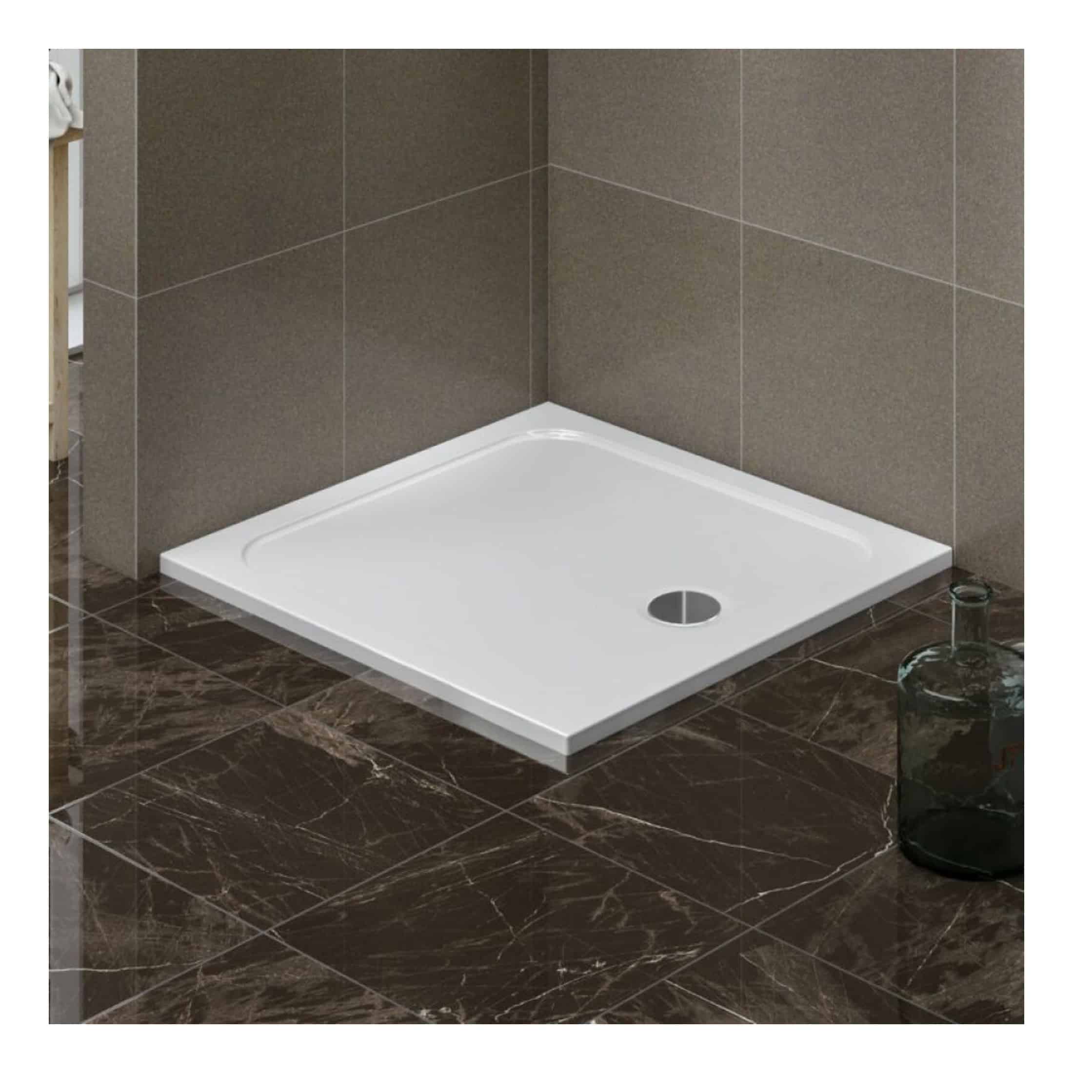 Modern white shower tray with a central drain, installed in a contemporary bathroom with dark brown marble flooring and beige tiled walls. Perfect for stylish bathroom renovations and walk-in showers.