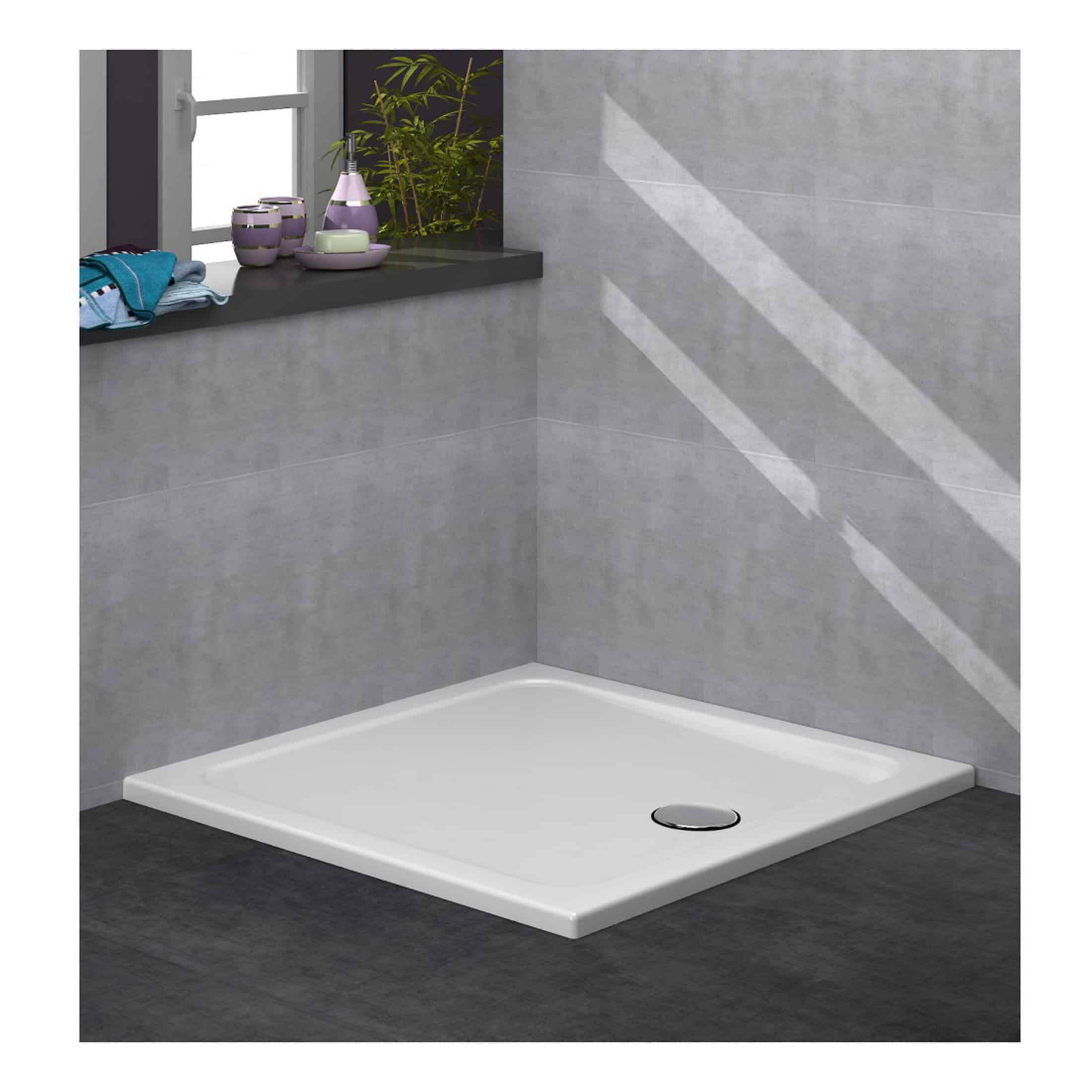 Shower tray with a modern, minimalist design installed in a contemporary bathroom with grey tiled walls and windowsill accessories, perfect for stylish wet room installations.