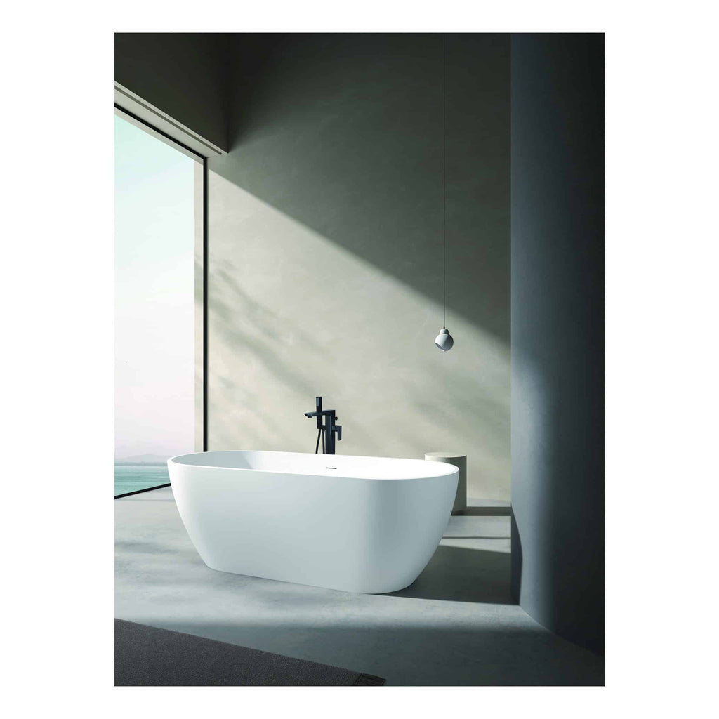 Smooth freestanding white bathtub in modern bathroom with floor-to-ceiling window and minimalist design, perfect for relaxing bath rituals and enhancing bathroom elegance.