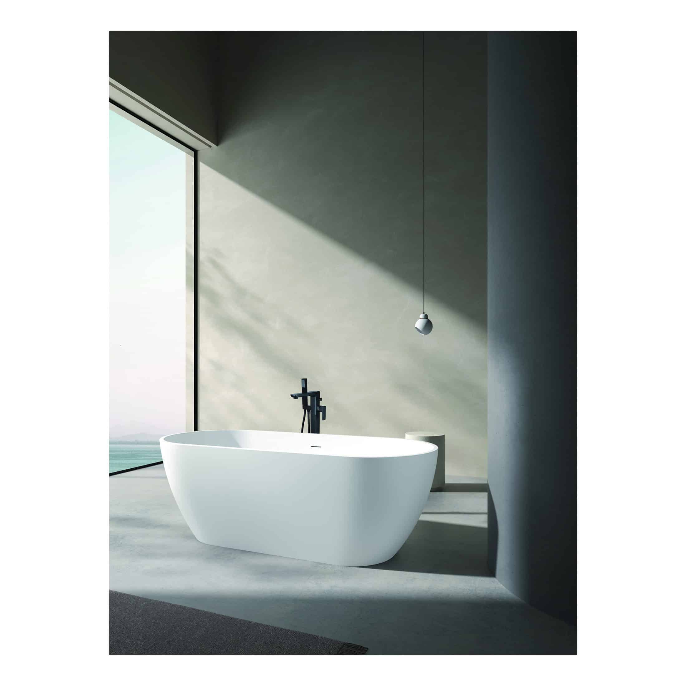 Smooth freestanding white bathtub in modern bathroom with floor-to-ceiling window and minimalist design, perfect for relaxing bath rituals and enhancing bathroom elegance.