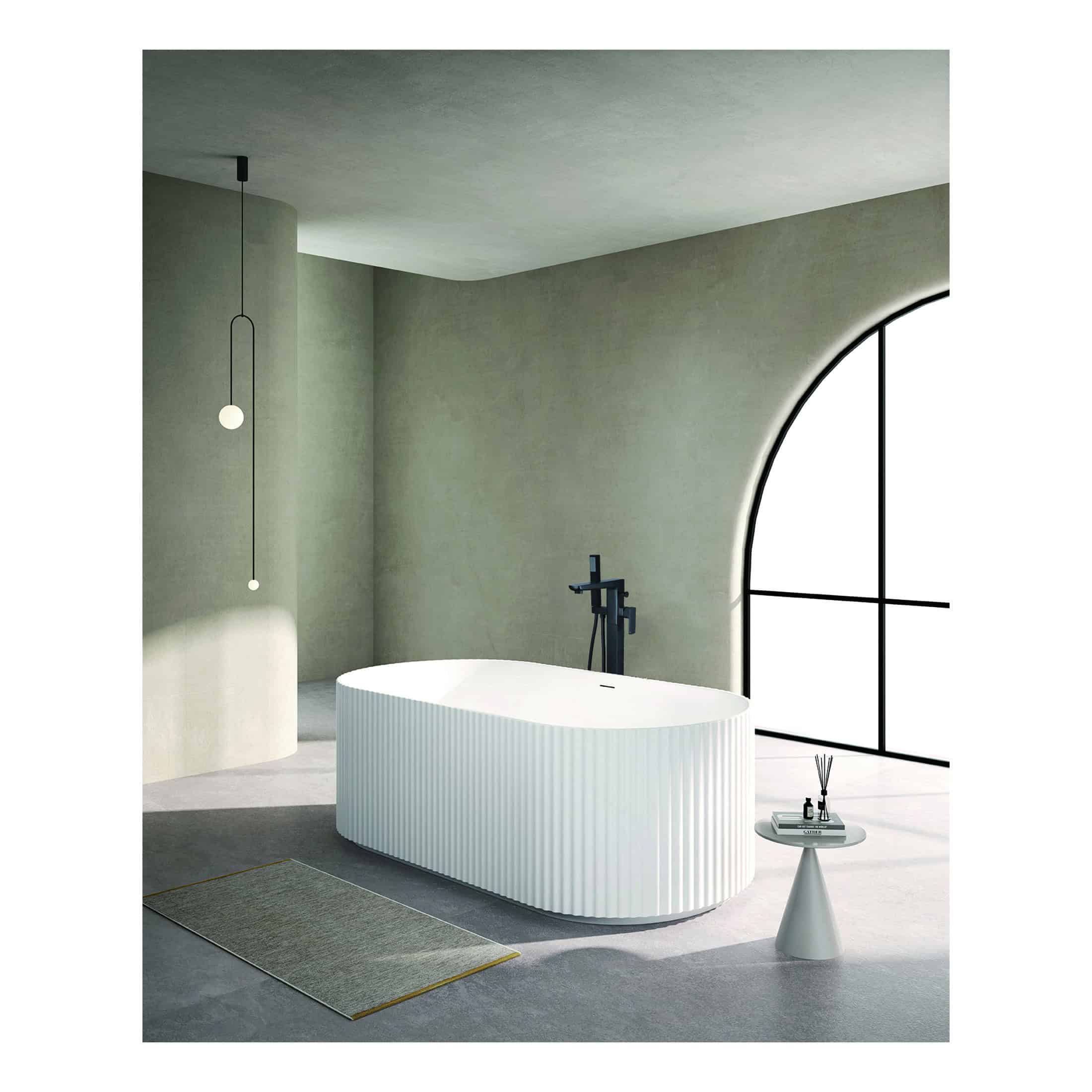 Sleek modern freestanding bathtub with ribbed texture, minimalist black fixtures, set in a contemporary bathroom with large window and neutral tones.