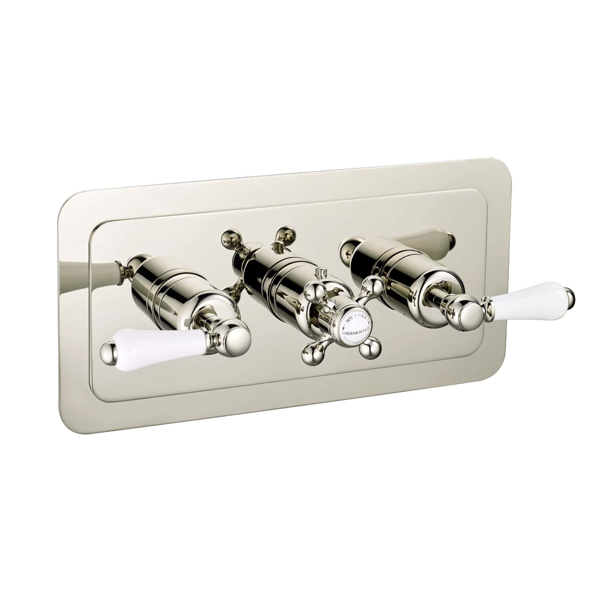 Polished chrome bathroom radiator valve set with white ceramic handles, ideal for heating control and matching traditional or vintage bathroom decor.