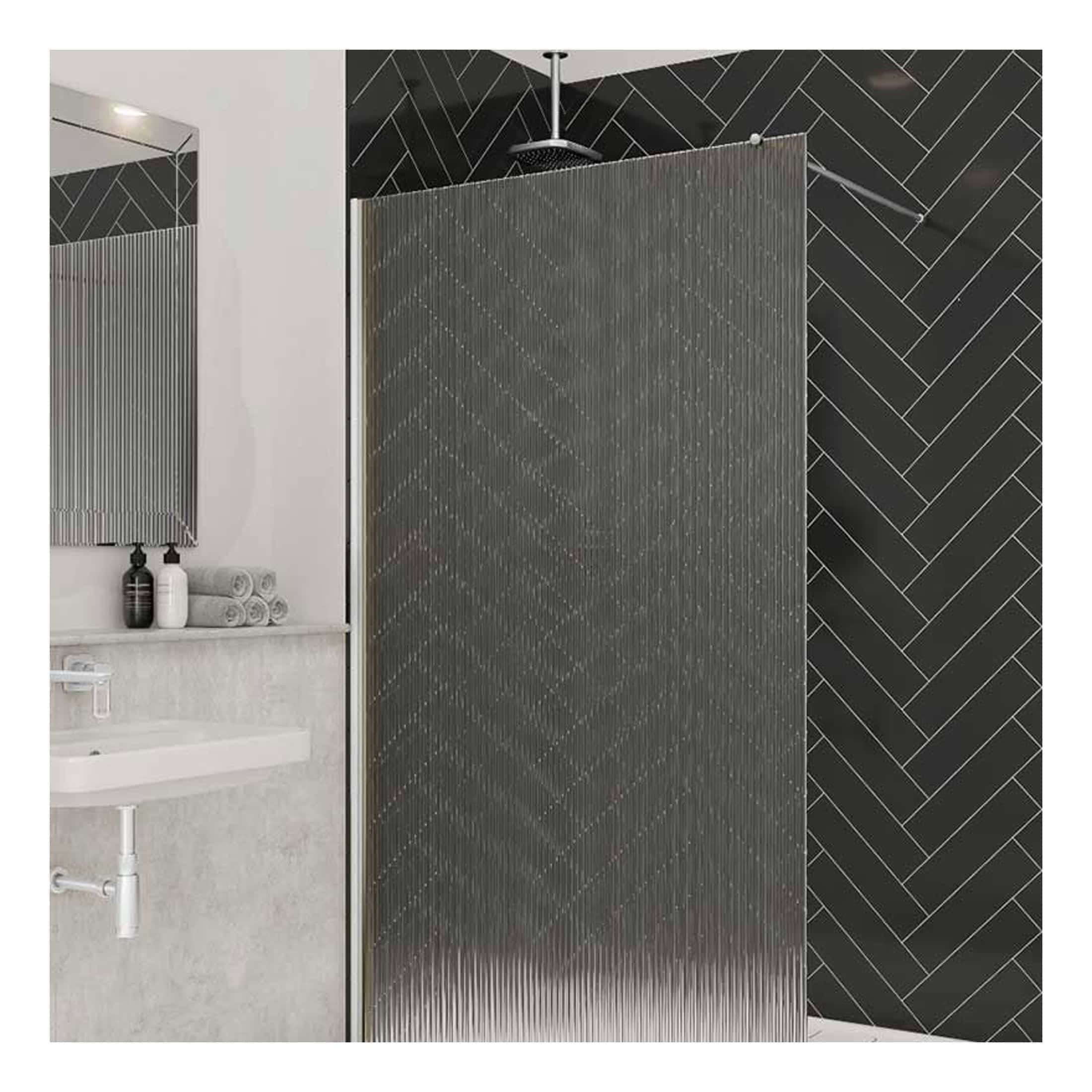 Sleek modern walk-in shower with a textured glass divider and black chevron wall tiles in a contemporary bathroom design.