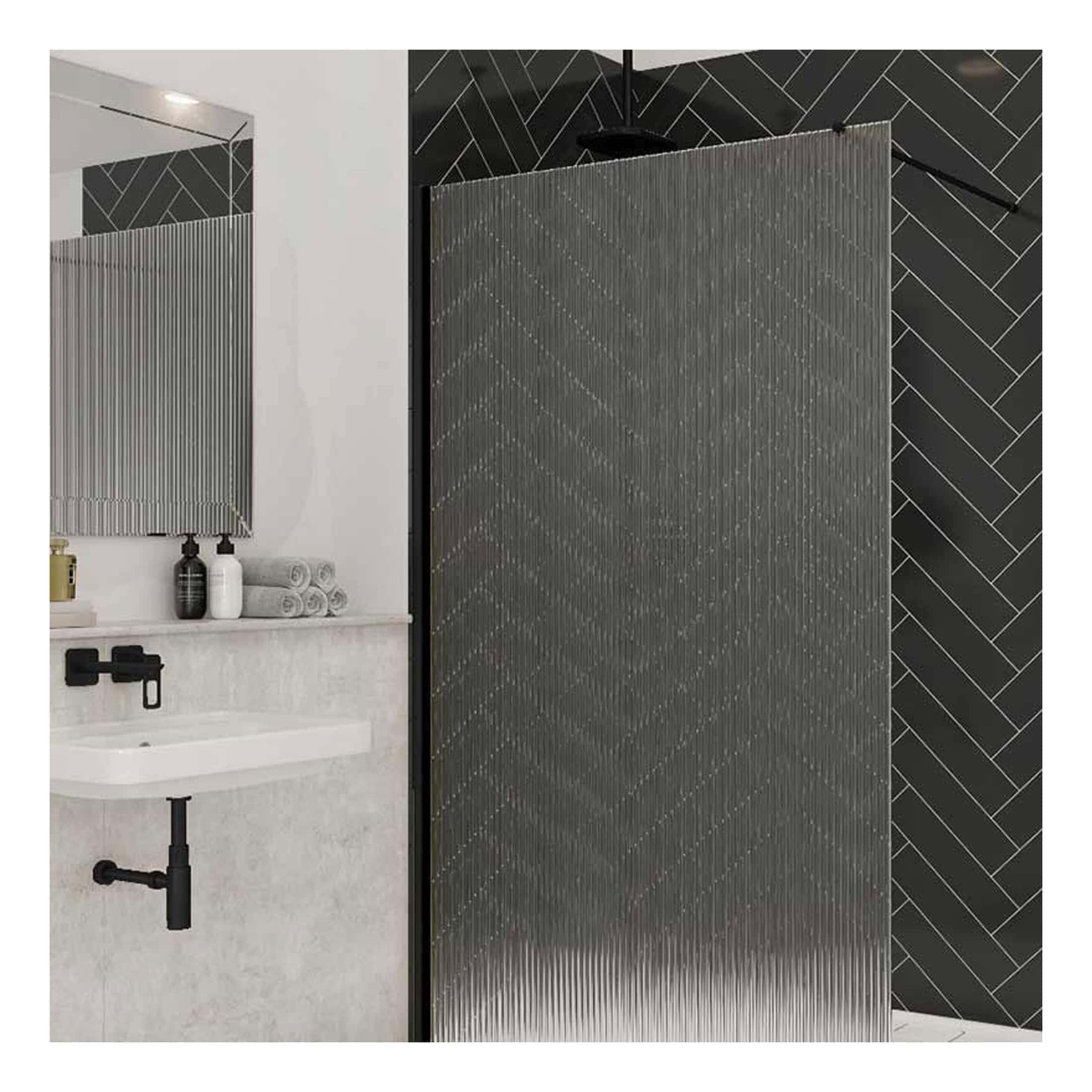 Contemporary black textured shower screen with dot pattern, grey herringbone wall tiles, modern white sink with black fixtures, minimalist bathroom design, vibrant and sleek appearance, stylish bathroom renovation.
