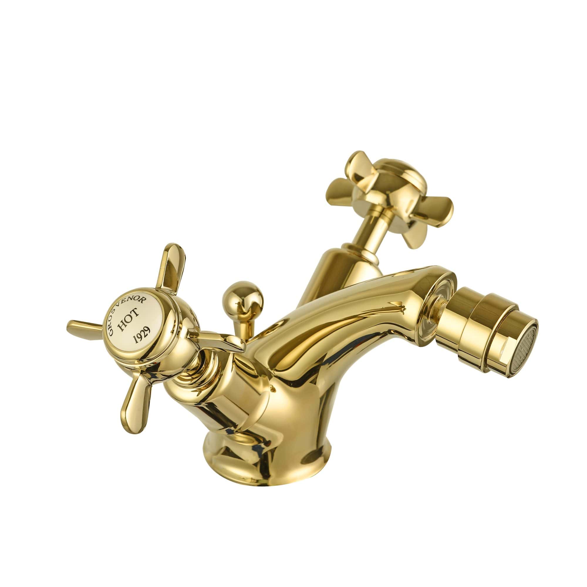 Shiny gold bathroom tap with classic cross handles and a vintage design, perfect for luxury bathroom renovations and traditional bathroom fixtures.