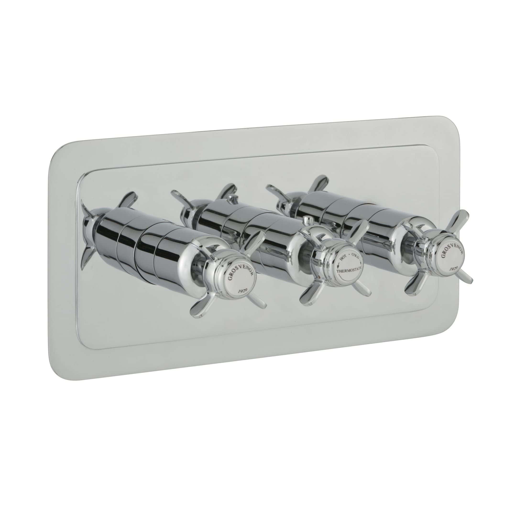 Polished chrome thermostatic radiator valves with a sleek white wall plate, designed for modern bathroom heating systems. Suitable for controlling temperature efficiently in luxury bathrooms.
