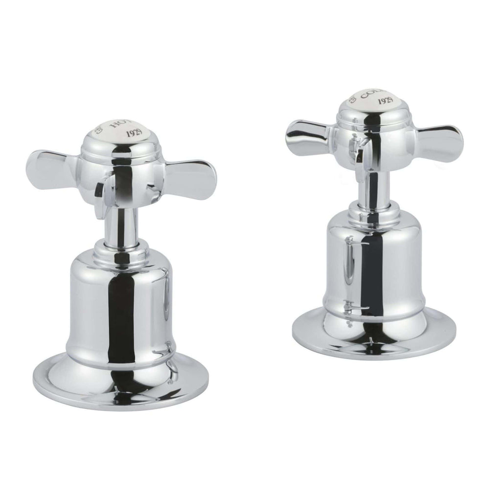 Shiny chrome bathroom taps with cross handles, designed for classic bathroom sinks, showcasing durable and elegant fixtures for contemporary and vintage bathroom remodels.