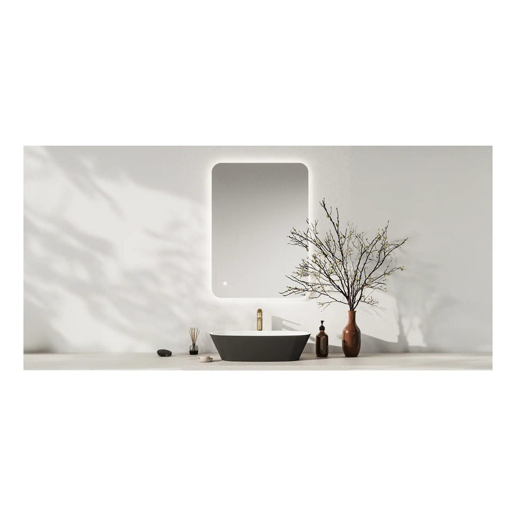 Sleek modern bathroom vanity with black basin, minimalist accessories, and a large mirror, creating a stylish and contemporary bathroom design for a relaxing space.