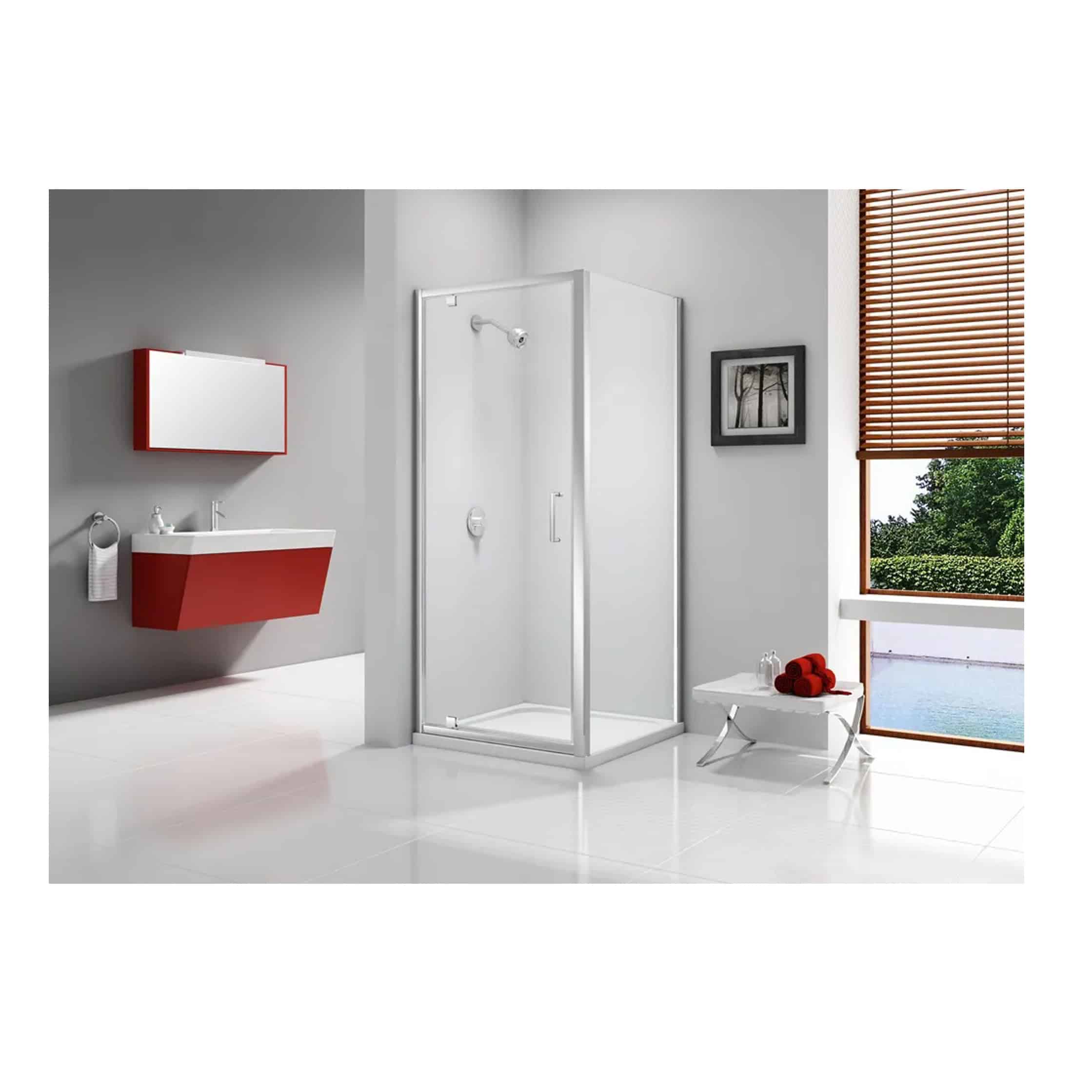 Modern bathroom with glass shower enclosure, red vanity unit, wall-mounted mirror cabinet, and nature view through wooden blinds, designed by Bubly Bathrooms.