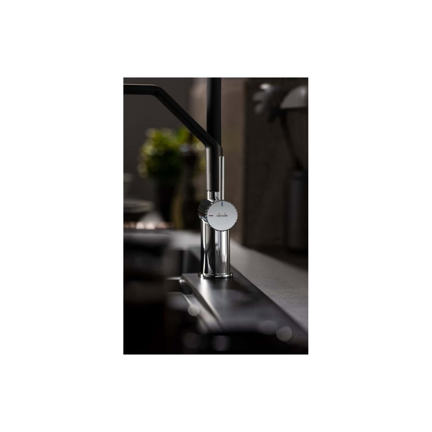 Sleek modern kitchen tap with chrome finish and adjustable temperature control, designed for stylish and functional bathroom or kitchen use.