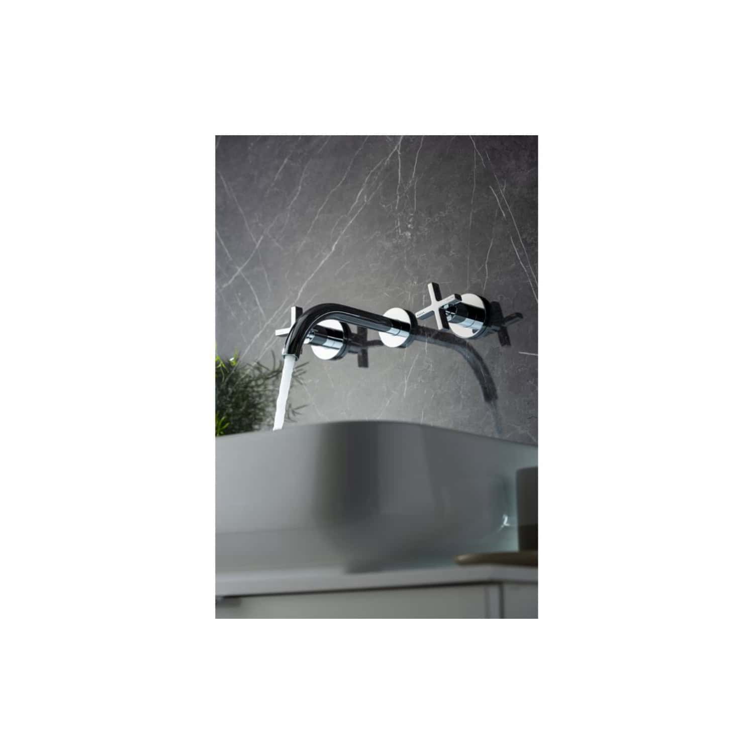 Modern chrome wall-mounted bathroom tap with water flowing into a sink, stylish design, perfect for contemporary bathrooms, high-quality fixtures, and elegant finish.