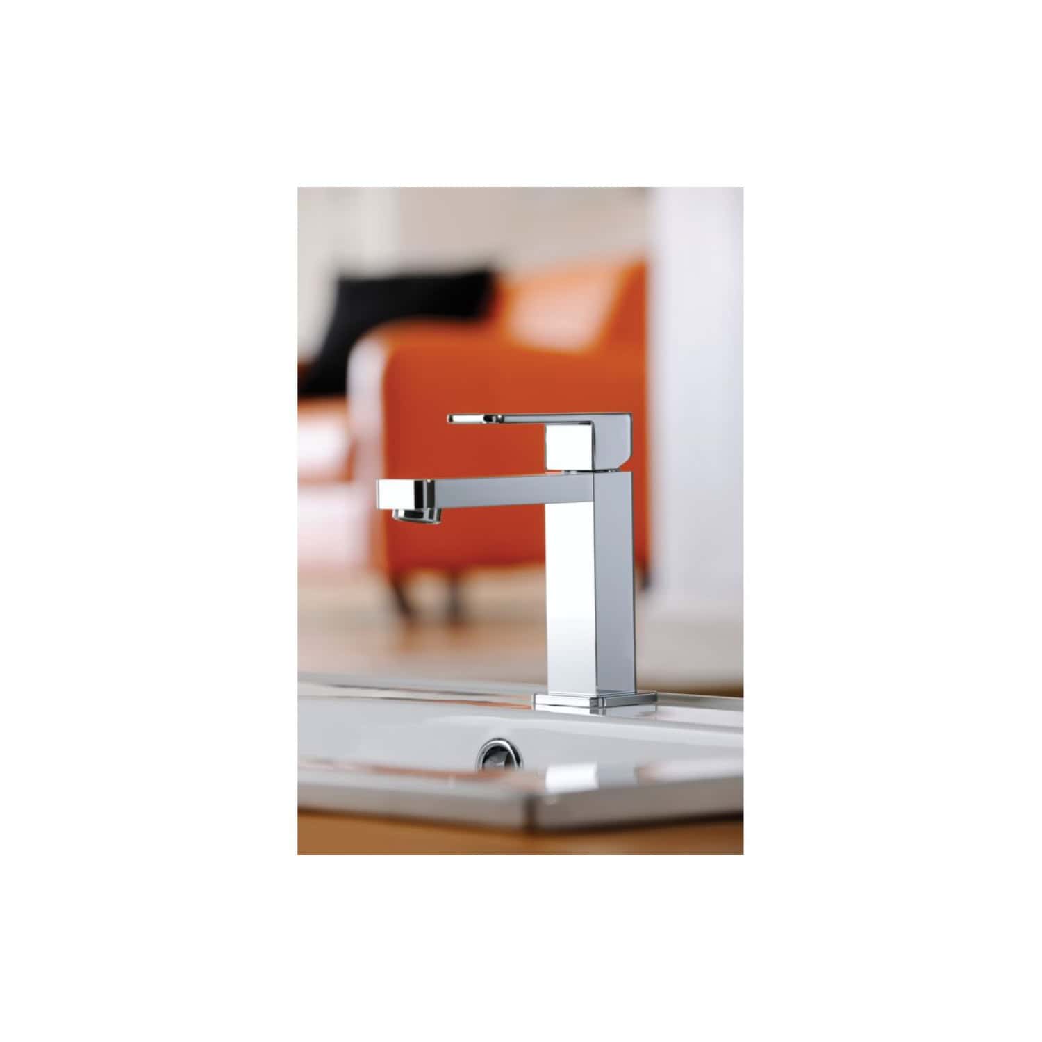 Sleek modern chrome bathroom tap mounted on a stainless steel sink with a contemporary design.