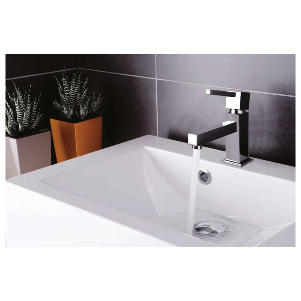 Sleek modern bathroom sink with contemporary chrome tap and dark tiled wall, featuring two stylish potted plants in the background, ideal for luxury bathroom design.
