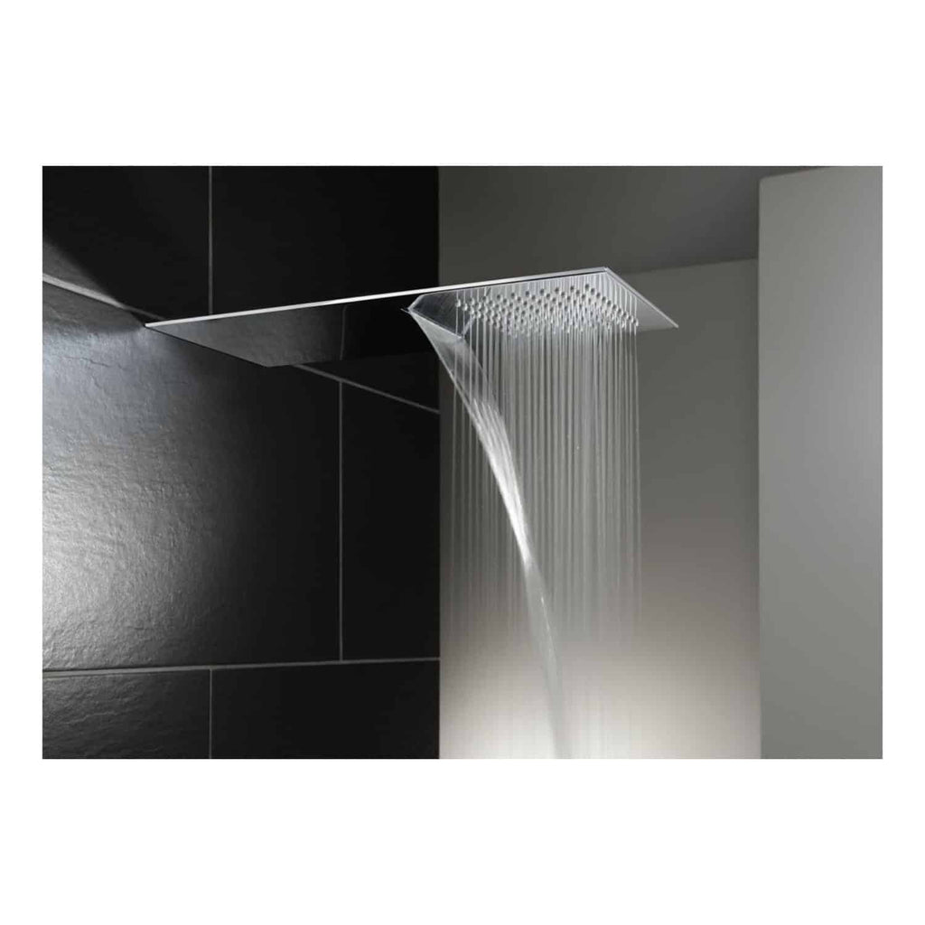 Sleek modern ceiling-mounted rainfall shower head with water flowing over black tiled bathroom wall, designed for luxury showering experience.
