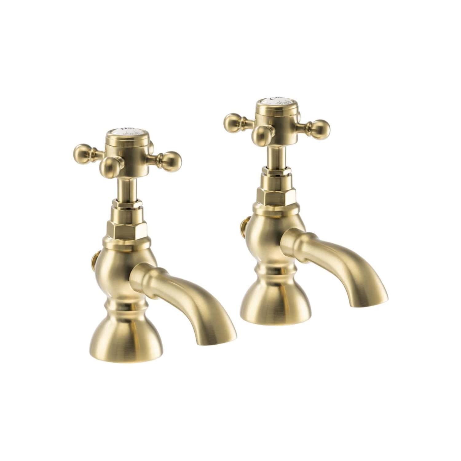 Polished brass vintage-style bathroom tap pair, traditional cross handle design, perfect for classic or antique bathroom sink decor.