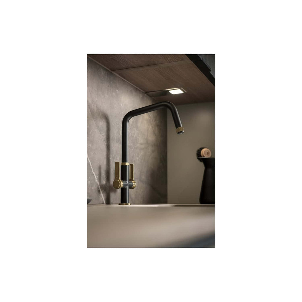 Black and brass modern kitchen sink tap with a matte finish, sleek design, and contemporary style, suitable for luxurious bathroom or kitchen renovation.