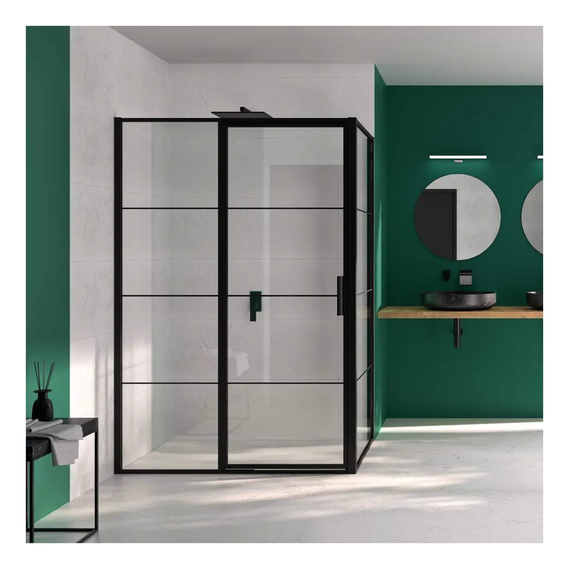Elegant modern bathroom with a stylish black-framed glass shower enclosure, dark vessel sinks, and a bold green accent wall offering a sleek, contemporary design.
