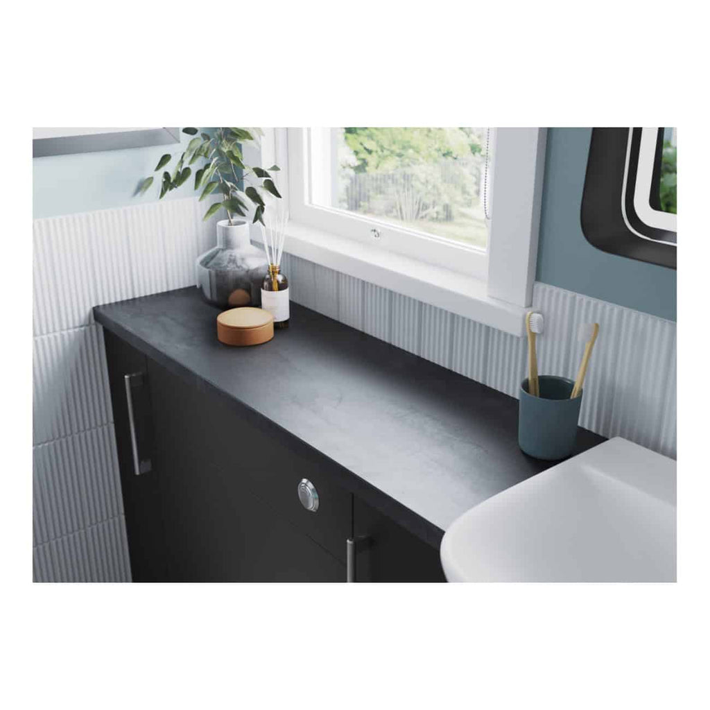 Modern bathroom vanity with sleek black countertop and stylish decor, including vases, a potted plant, and bathroom accessories, featuring a large window with a scenic view.