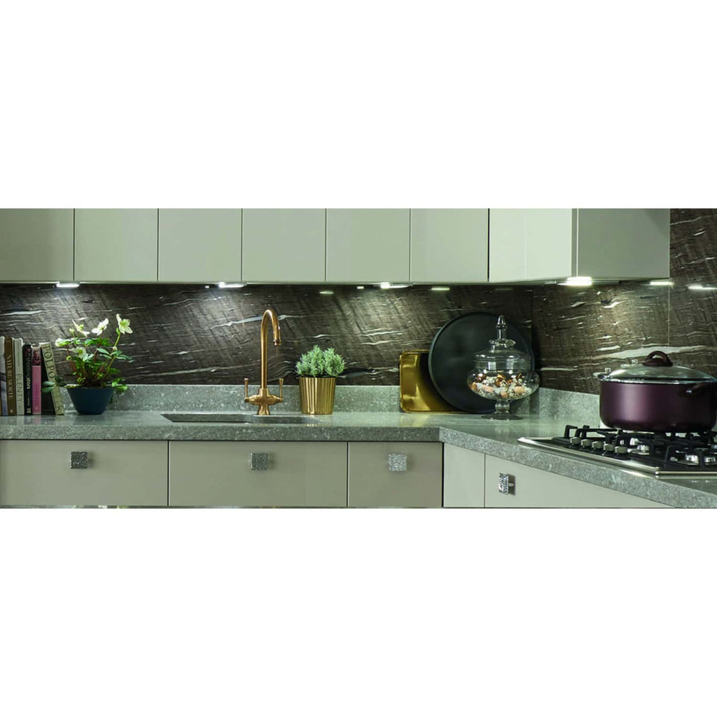 Elegant modern kitchen with sleek grey cabinetry, a marble backsplash, and gold accents, showcasing luxury kitchen design ideas from Bubly Bathrooms.