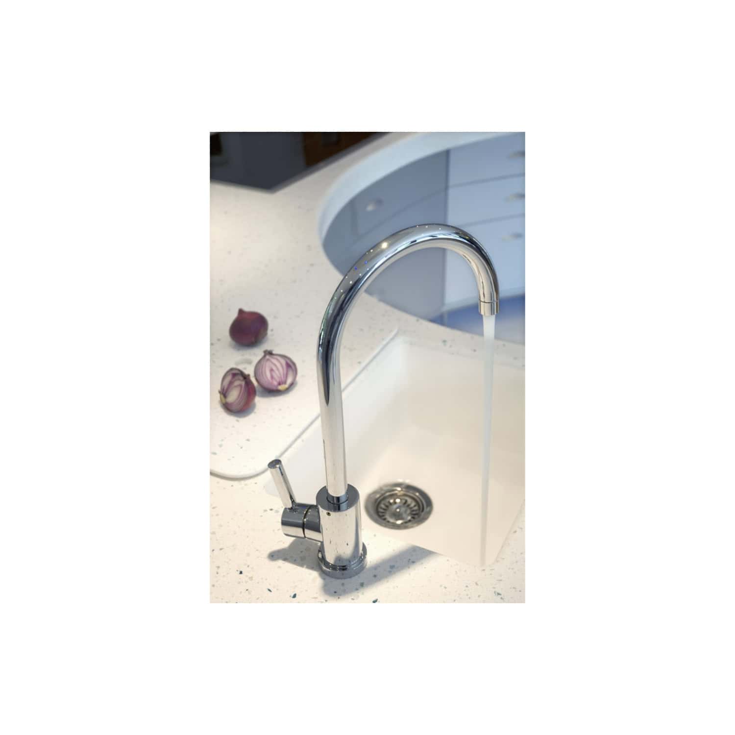 Shiny chrome kitchen tap with running water on a white speckled sink, modern design, with purple shallots on the countertop, showcasing stylish and functional bathroom or kitchen fixtures.