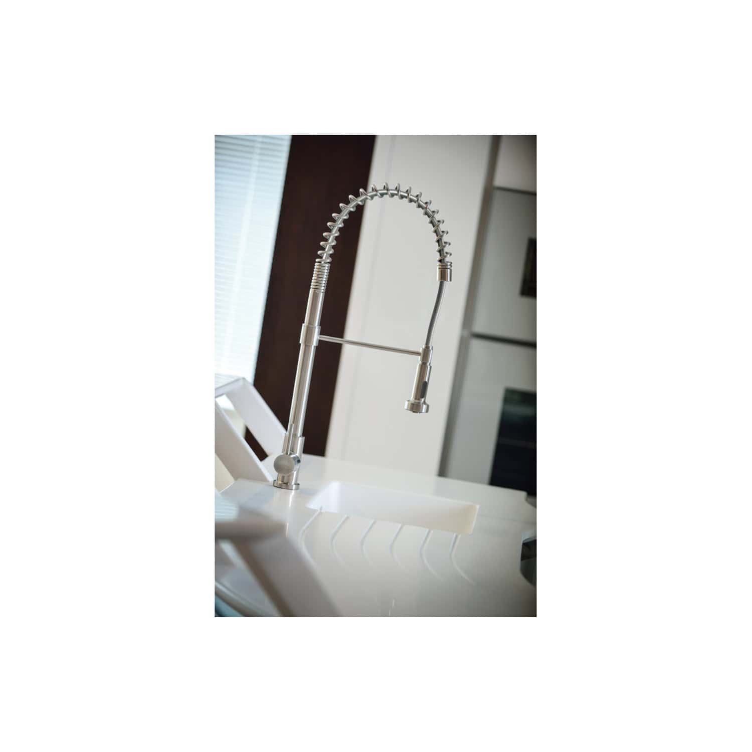 Flexible stainless steel kitchen sink tap with high-arc design, spring hose, and modern swivel spout for efficient water usage and cleaning in contemporary bathrooms or kitchens.