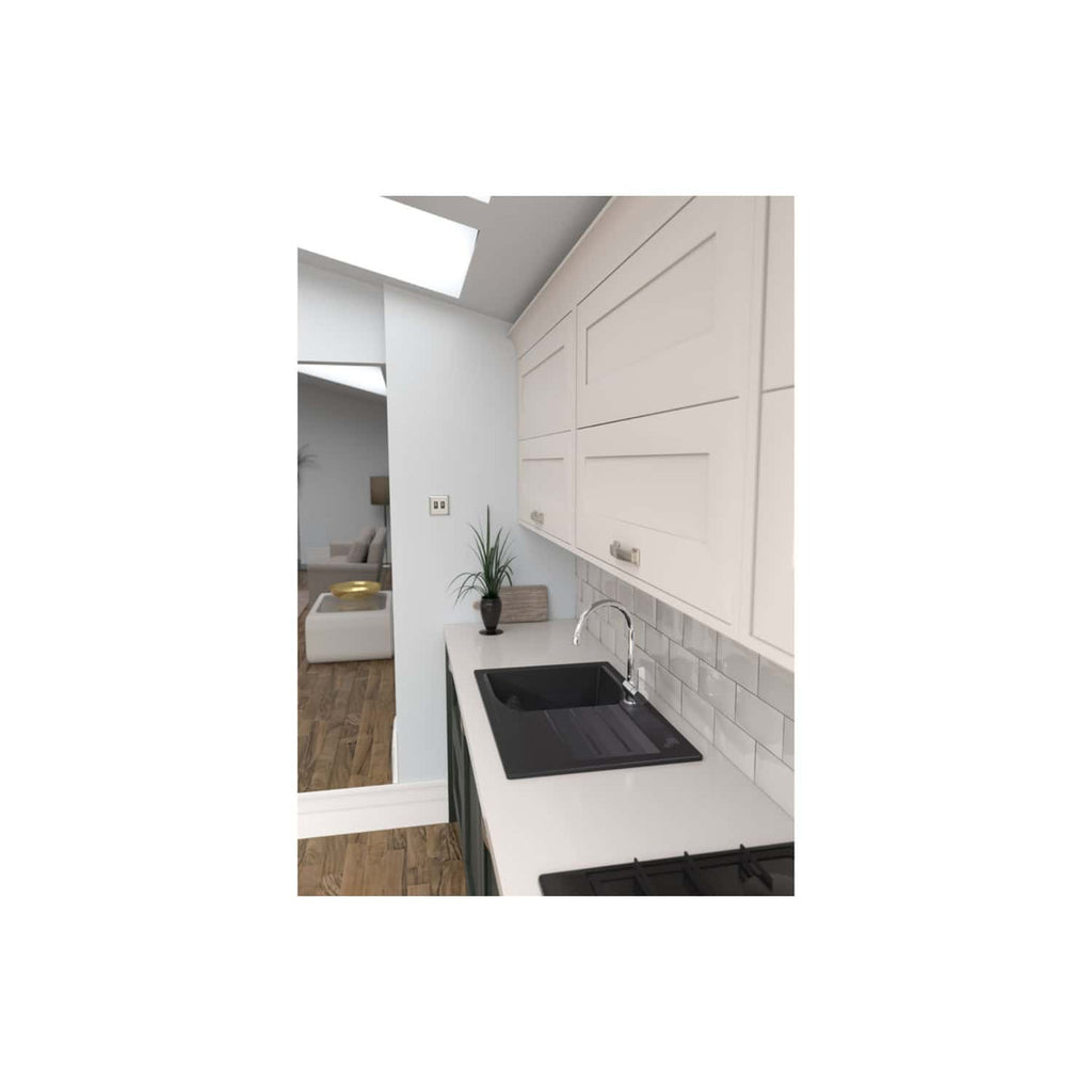 Bright modern kitchen with white cabinetry, black sink, and tiled backsplash in an open-plan living space. Designed for stylish and functional use in contemporary home interiors.