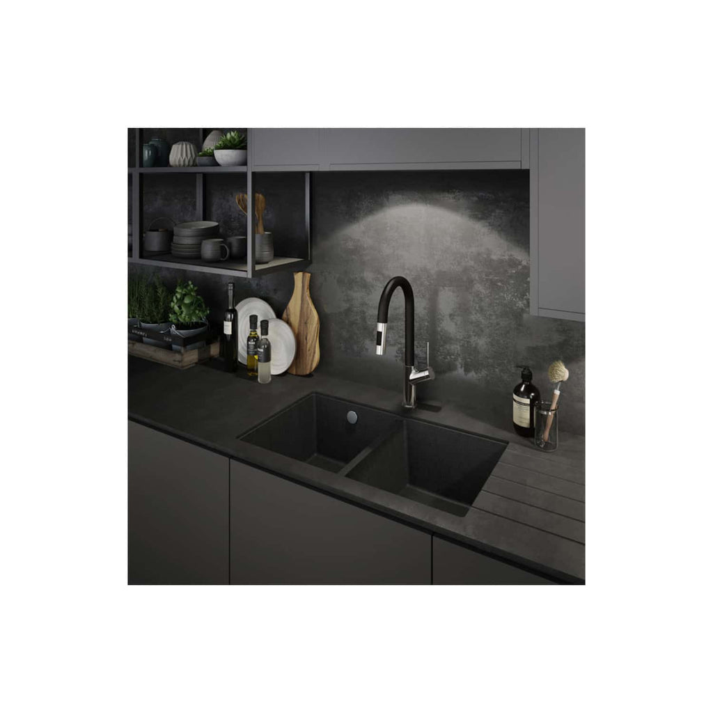 Sleek black kitchen sink with modern pull-down tap, grey cabinetry, open shelving with stylish dishes and plants, and a textured grey backsplash for contemporary kitchen design.