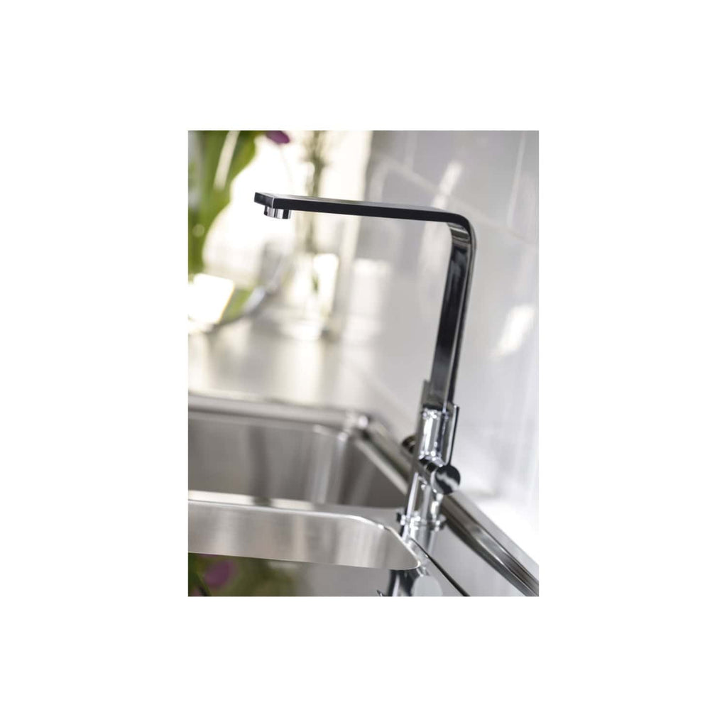 Luxury black kitchen tap with modern design in a contemporary kitchen setting.