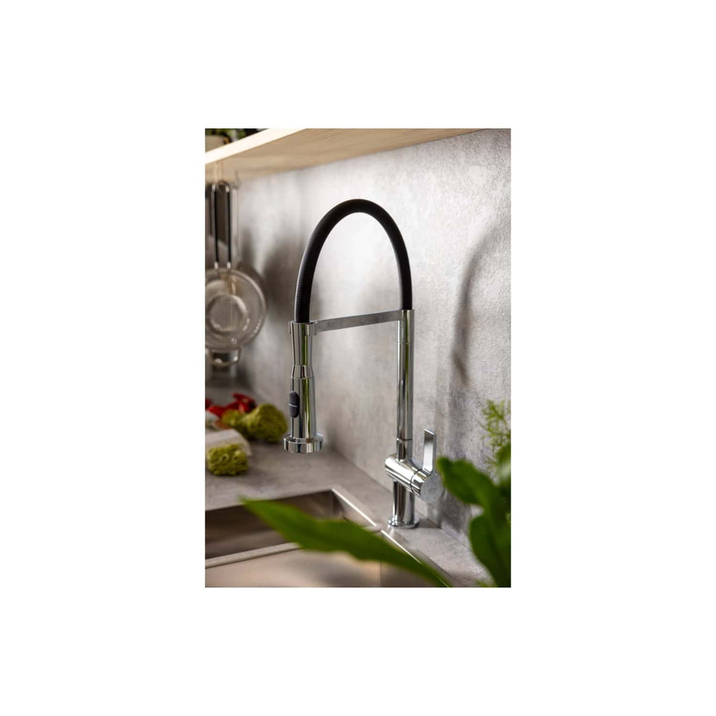 Modern kitchen sink with a sleek chrome faucet and black flexible hose, set against a grey stone backsplash, featuring contemporary design and functional appliances for stylish kitchen plumbing.
