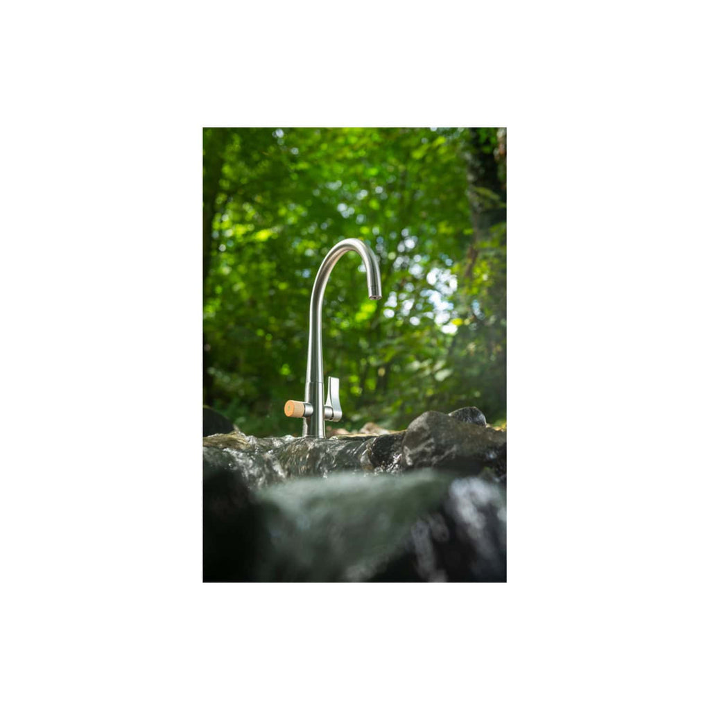 Shower faucet outdoor stream nature garden eco-friendly water column urban outdoor bathroom design bubly bathrooms water-saving fixtures eco-conscious outdoor water tap sustainable plumbing outdoor shower outdoor water feature water conservation water efficiency outdoor natural water source outdoor home water upgrade.