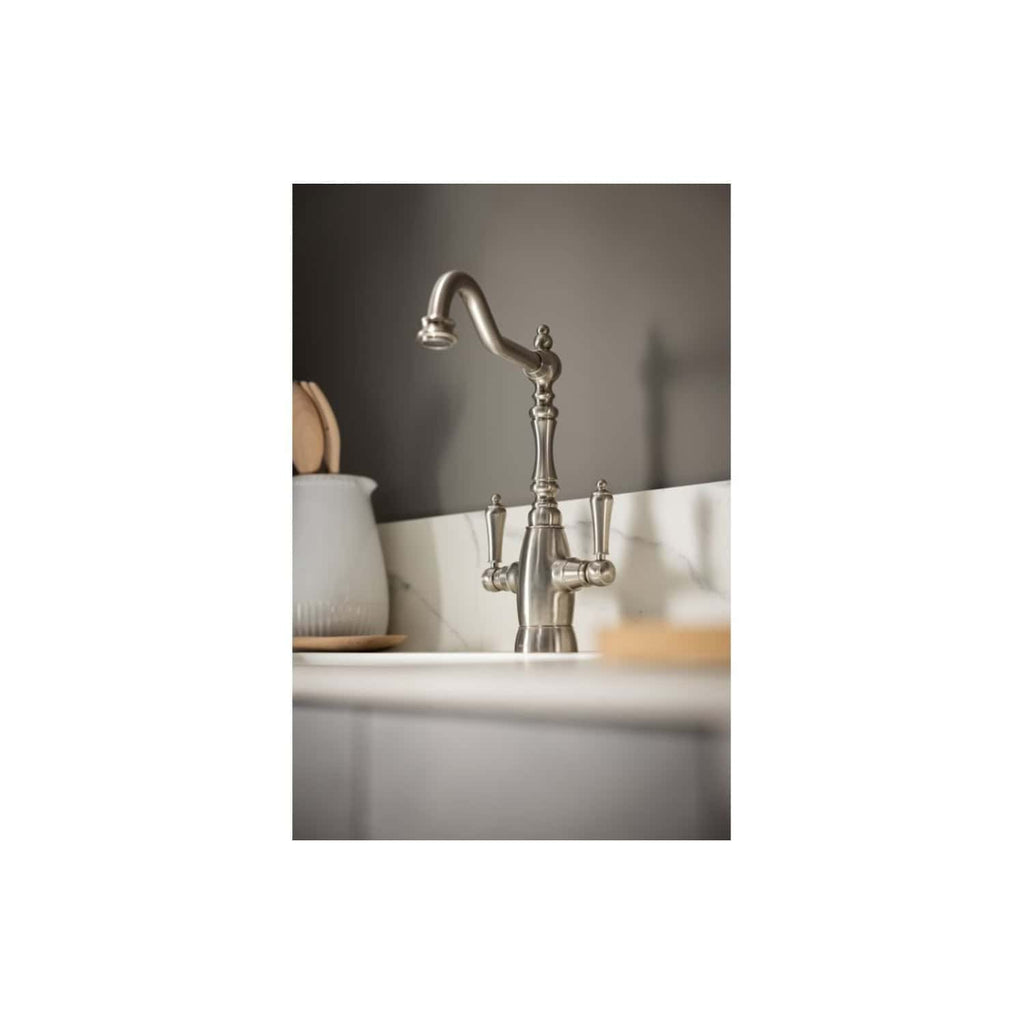 Brushed nickel kitchen sink tap with traditional design, suitable for modern and classic bathrooms and kitchens, providing elegant functionality.
