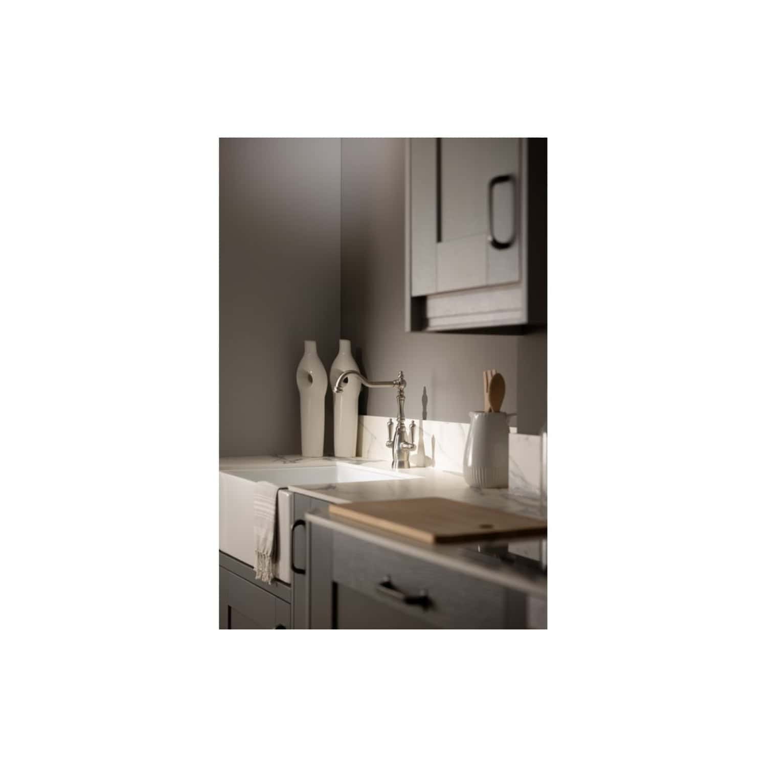 Luxurious grey kitchen with modern white ceramic sink, contemporary cabinetry, and stylish accessories. Perfect for elegant and functional bathroom or kitchen renovation by Bubly Bathrooms.