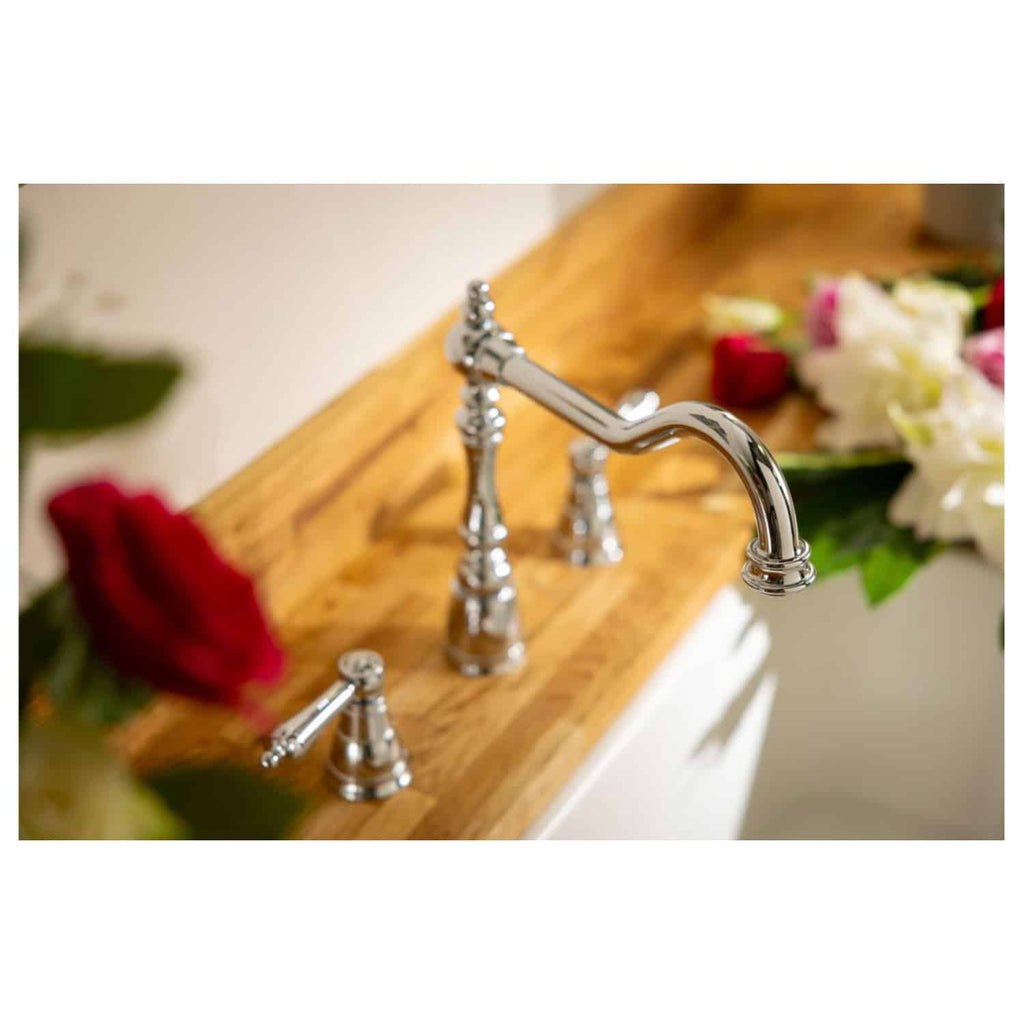 Polished chrome vintage bathroom tap with floral arrangement on a wooden vanity, showcasing classic bathroom fixtures and elegant decor. Perfect for luxury home bathroom design.