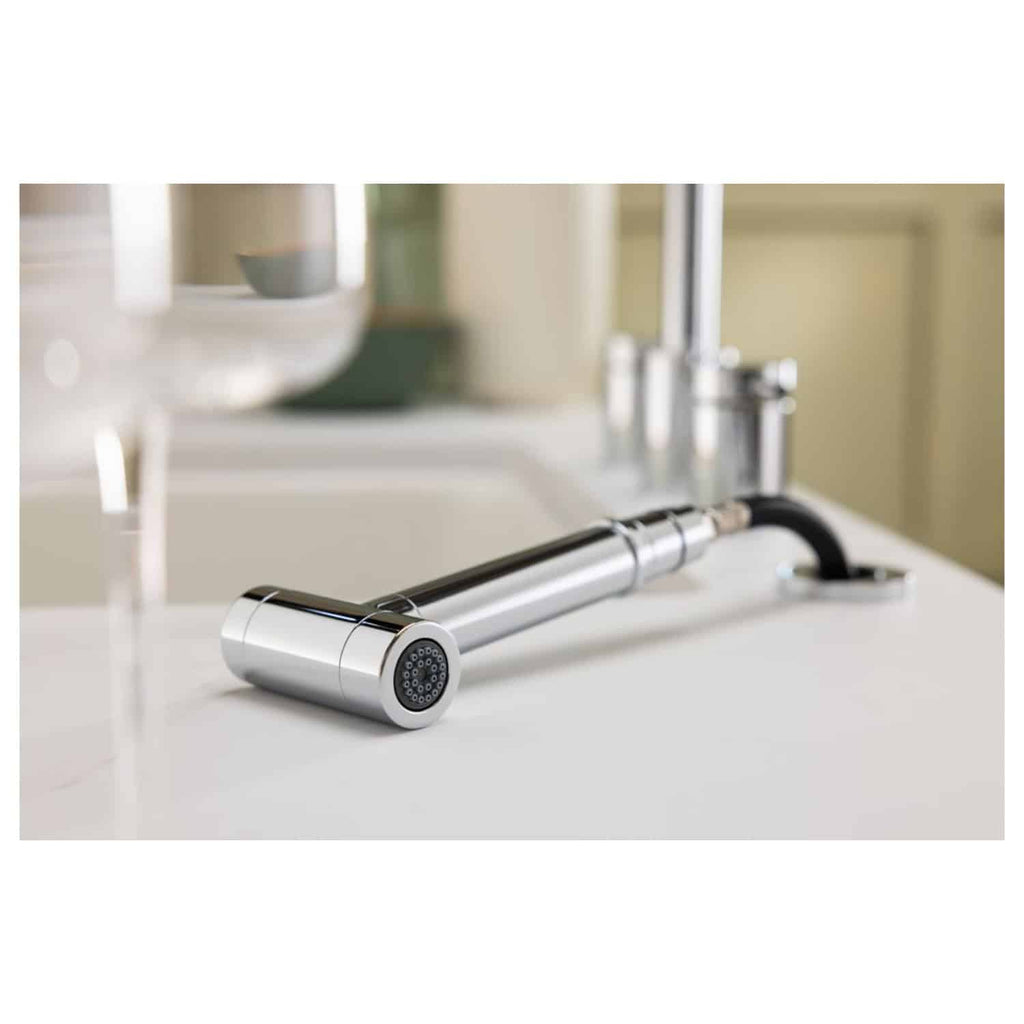 Sleek modern chrome kitchen tap with flexible black hose on white countertop, part of Bubly Bathrooms' high-quality bathroom fixtures and fittings collection.