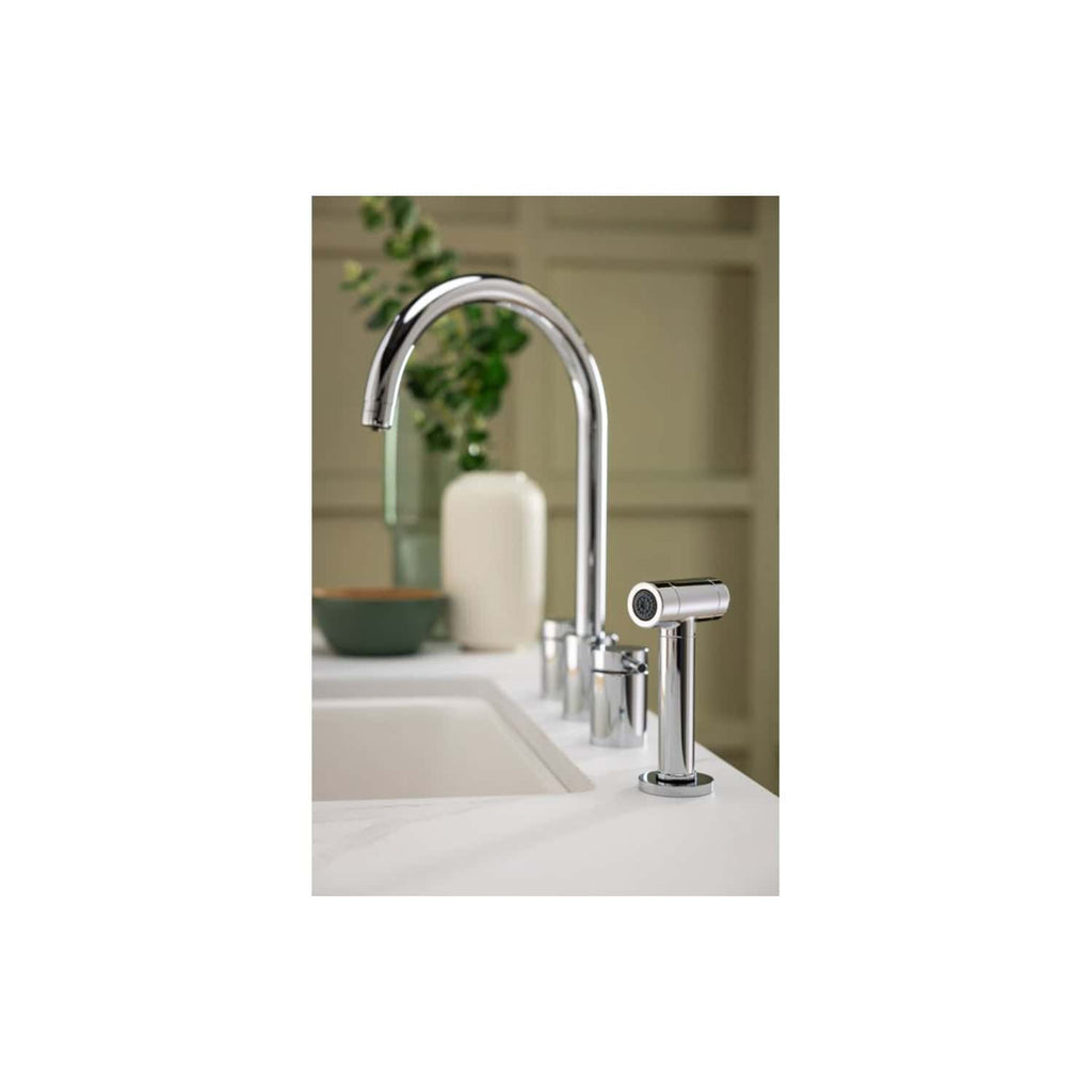 Sleek chrome kitchen tap with a modern design over a white sink, complemented by a filtered water dispenser, perfect for contemporary bathroom or kitchen renovation.