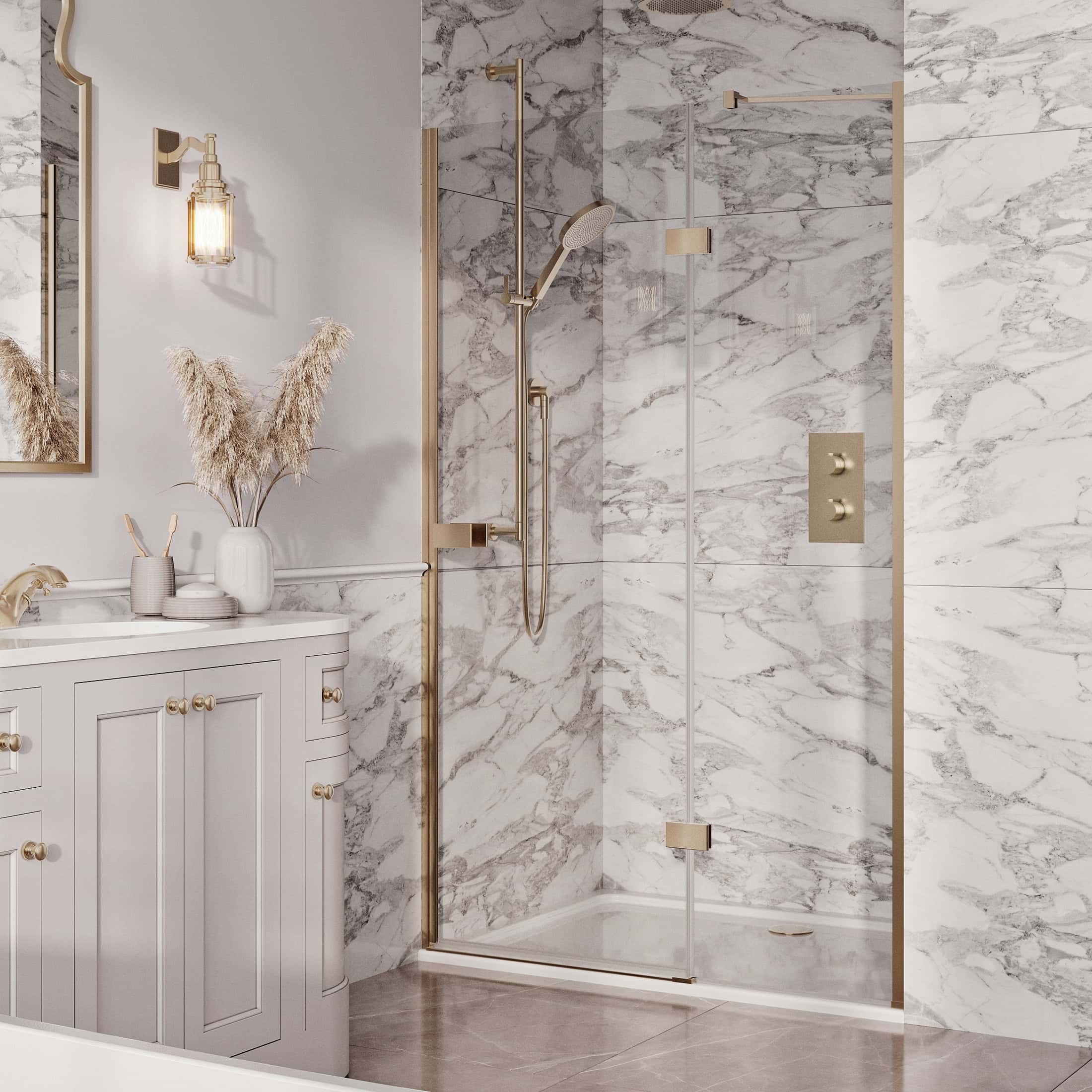 Sleek modern bathroom with marble walls and gold accents in shower area and vanity, featuring a white cabinet and decorative decor for luxury bathroom design.
