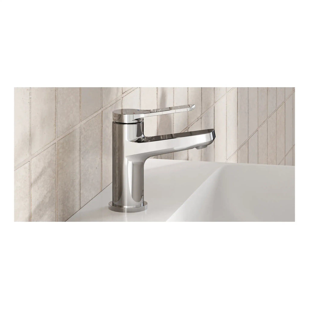 Sleek chrome bathroom tap on white sink, modern design with polished finish, perfect for contemporary bathrooms, high-quality fixtures, and easy to operate.