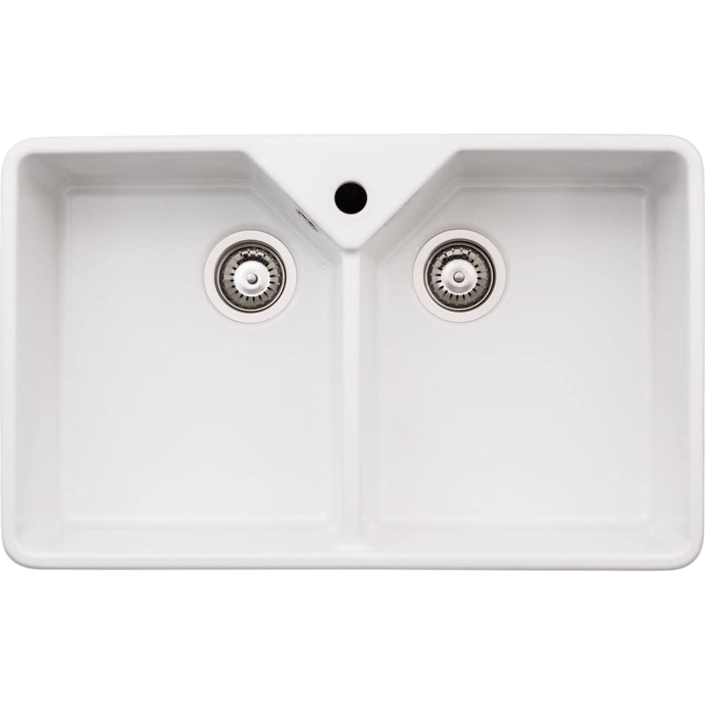 Shallow double-basin white kitchen sink with modern stainless steel drains and an overflow hole, ideal for contemporary bathroom or kitchen renovation projects.