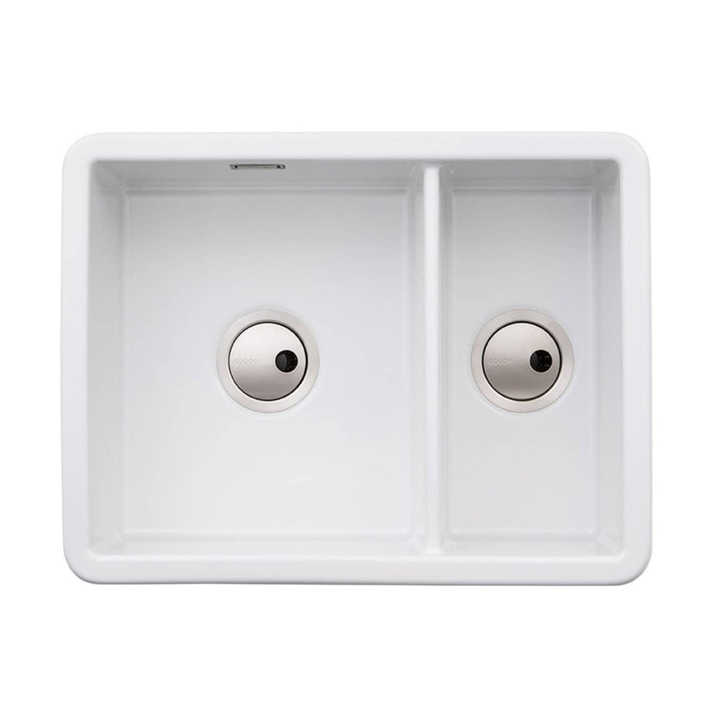 Modern double-basin white kitchen sink with undermount installation, durable ceramic material, and sleek design for contemporary bathrooms and kitchens.