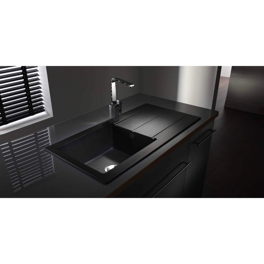 Sleek black kitchen sink with modern chrome tap, integrated into a minimalist dark countertop, featuring a practical draining area and sleek cabinetry, ideal for contemporary bathroom or kitchen designs.