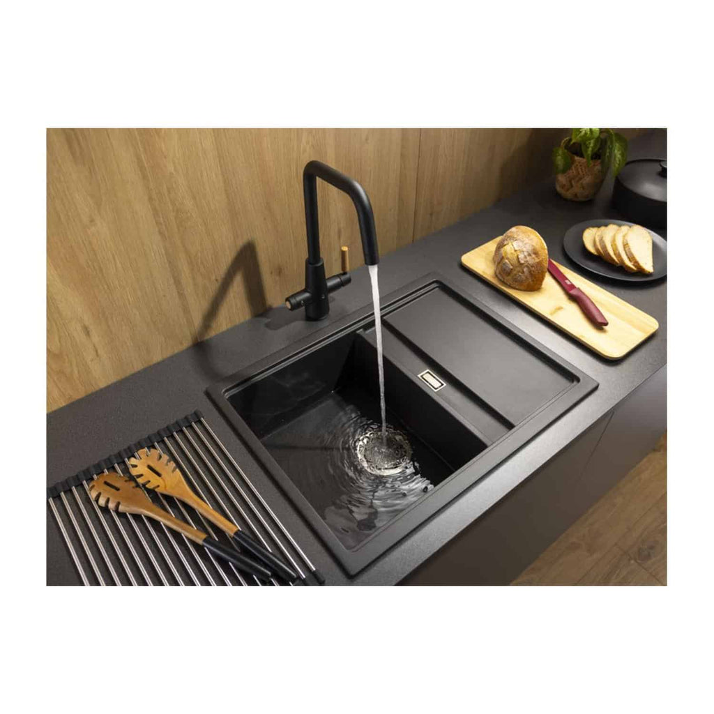 Sleek black kitchen sink with modern design and matte finish, featuring an elegant black tap and spacious basin, ideal for contemporary kitchen settings.