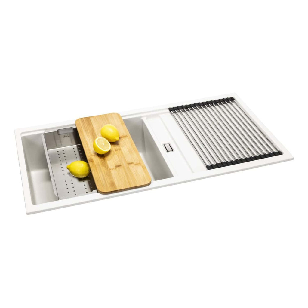 Stainless steel kitchen sink with integrated draining board, wooden chopping board, and lemon slices, ideal for modern kitchen renovations and cooking prep.