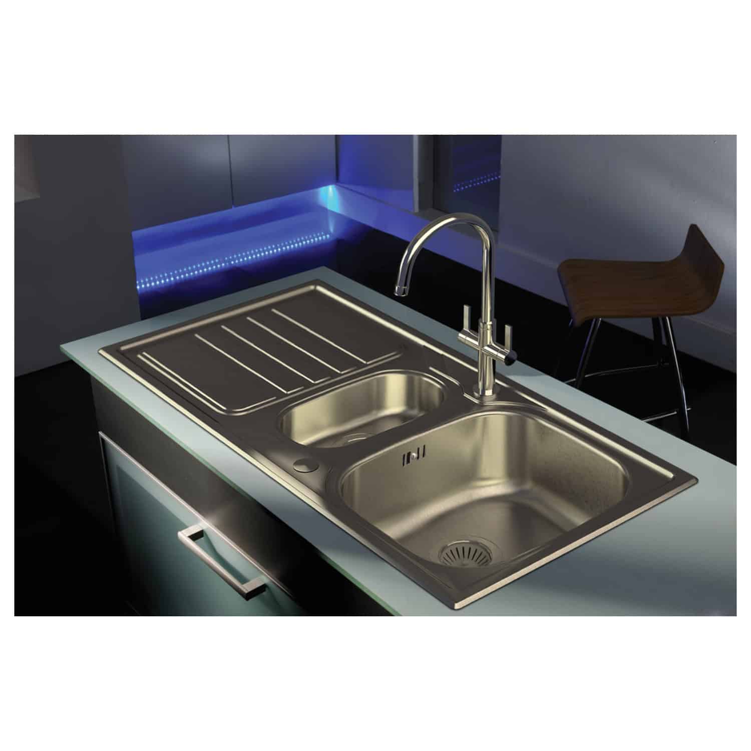 Stainless steel kitchen sink with dual bowls and integrated drainboard, modern design in a contemporary kitchen setting. Perfect for culinary and cleaning tasks.